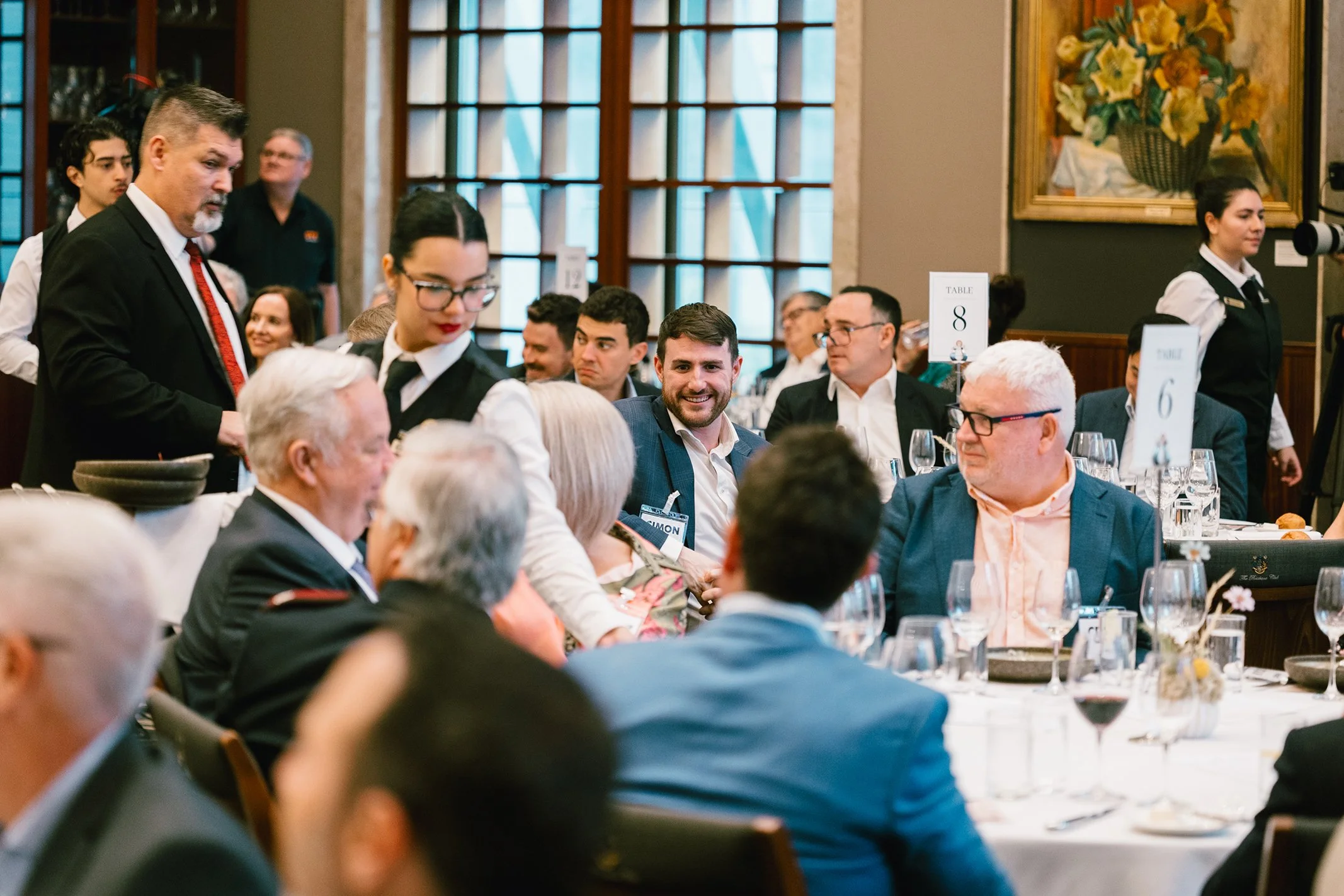 Business leaders seated together at a professional networking event