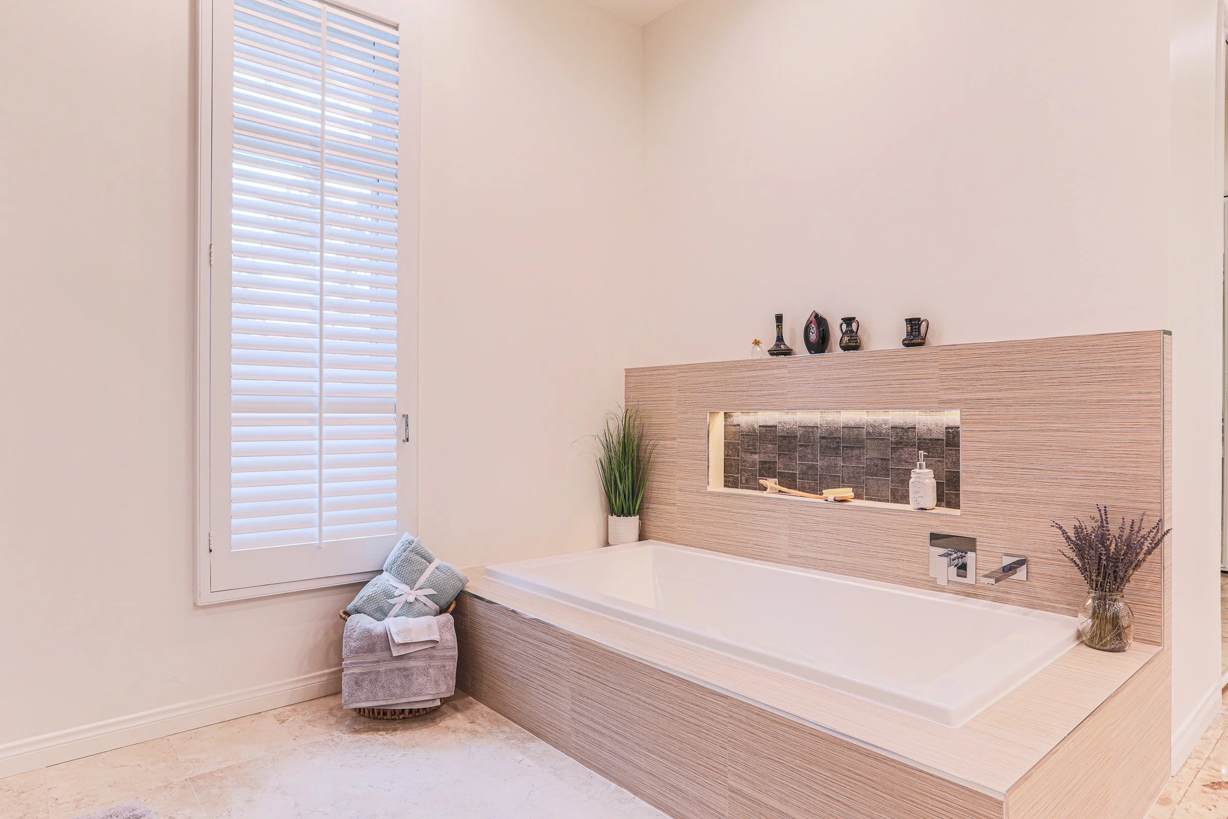 luxury bathroom remodel with soaking tub and modern tile design in Orange County