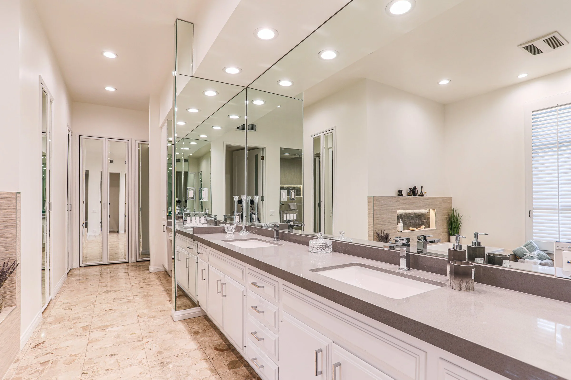 Modern bathroom remodel in Orange County with double sink vanity, quartz countertops and glass walk-in shower
