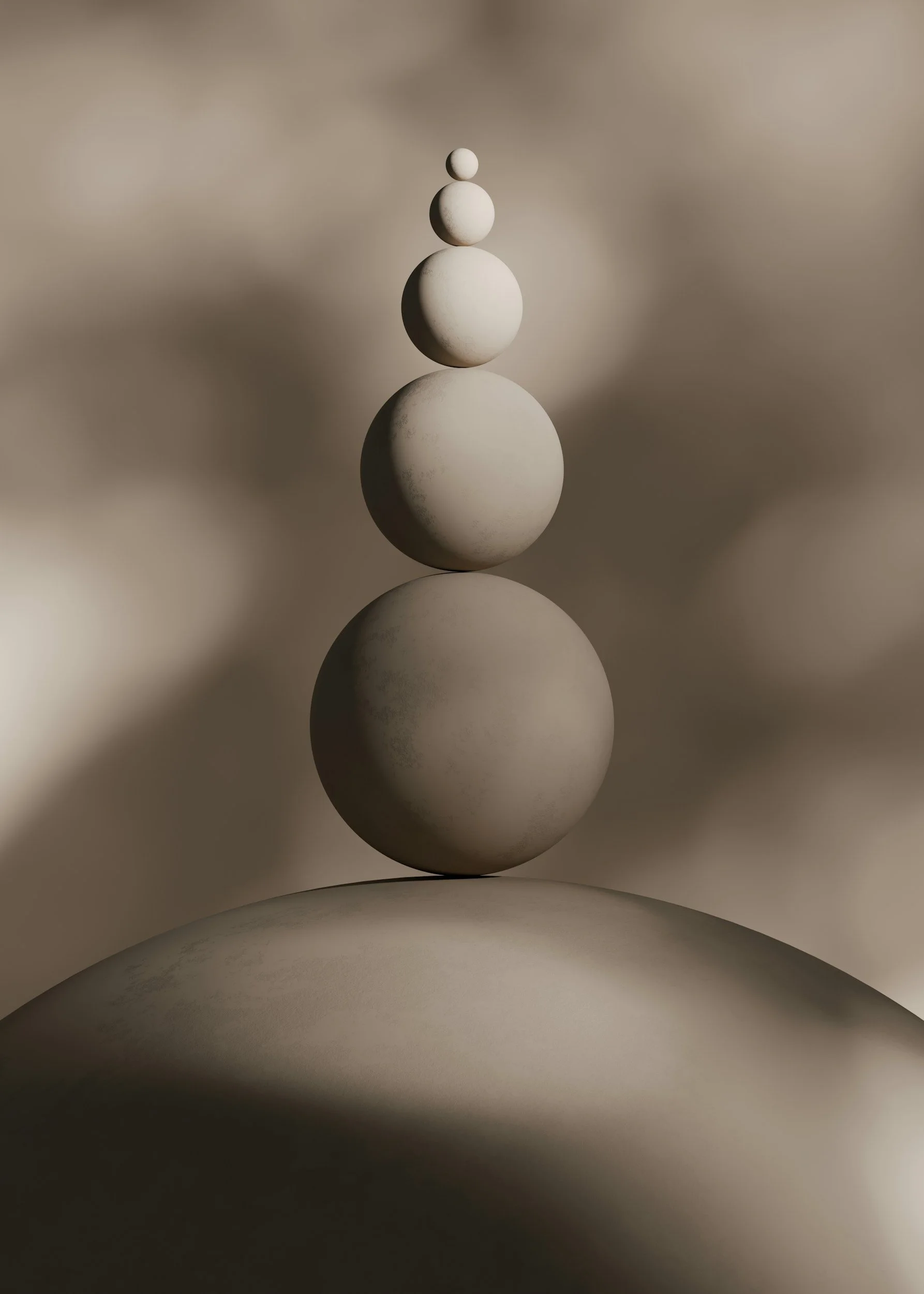 Five white spheres decreasing in size stacked vertically on a curved surface with blurred background.