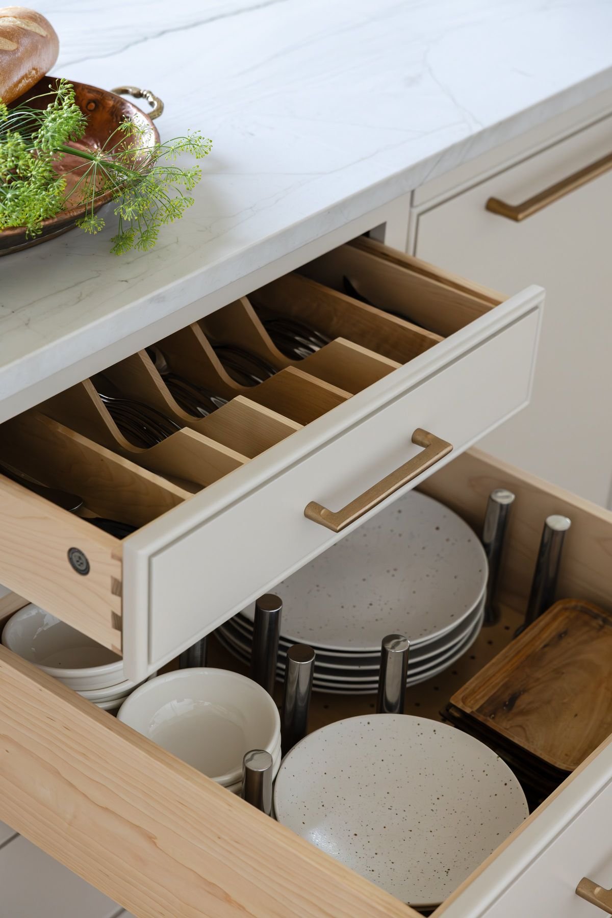 Beautiful custom kitchen drawers to store cutlery and dinnerware more efficiently