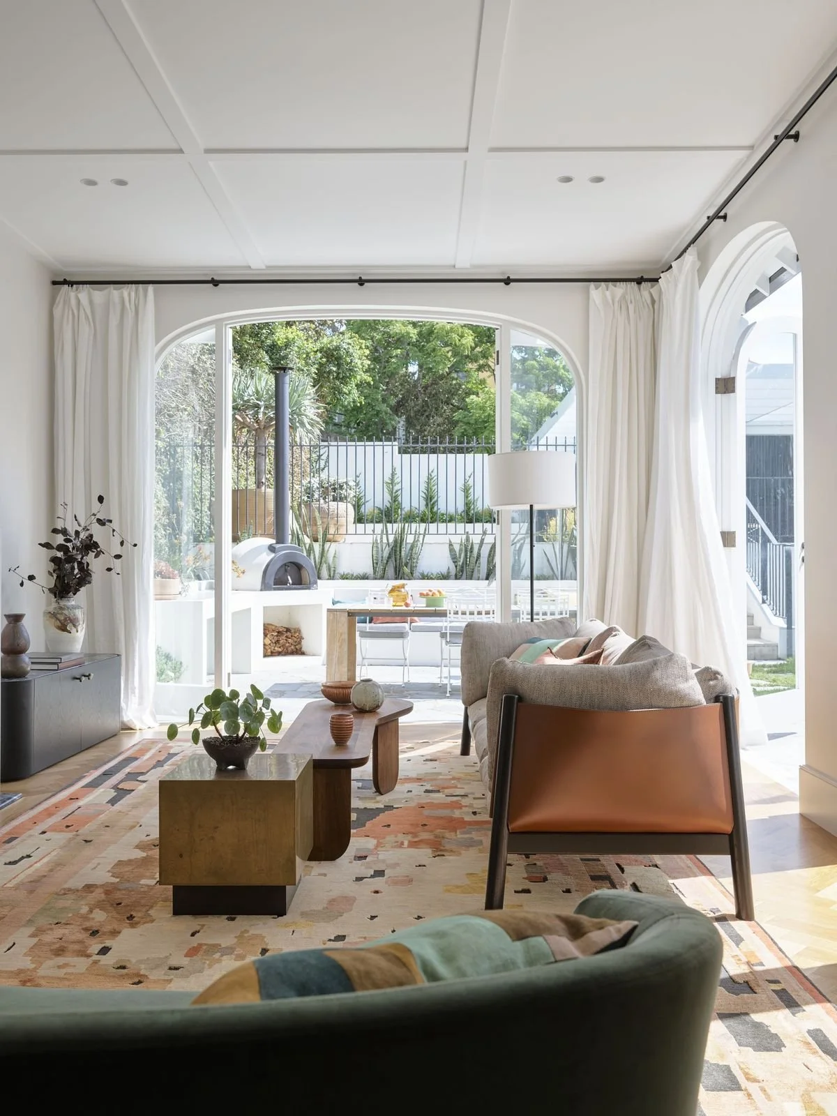 Modern, bright living room with sleek square decorative ceiling trims above adding texture and layers to the room