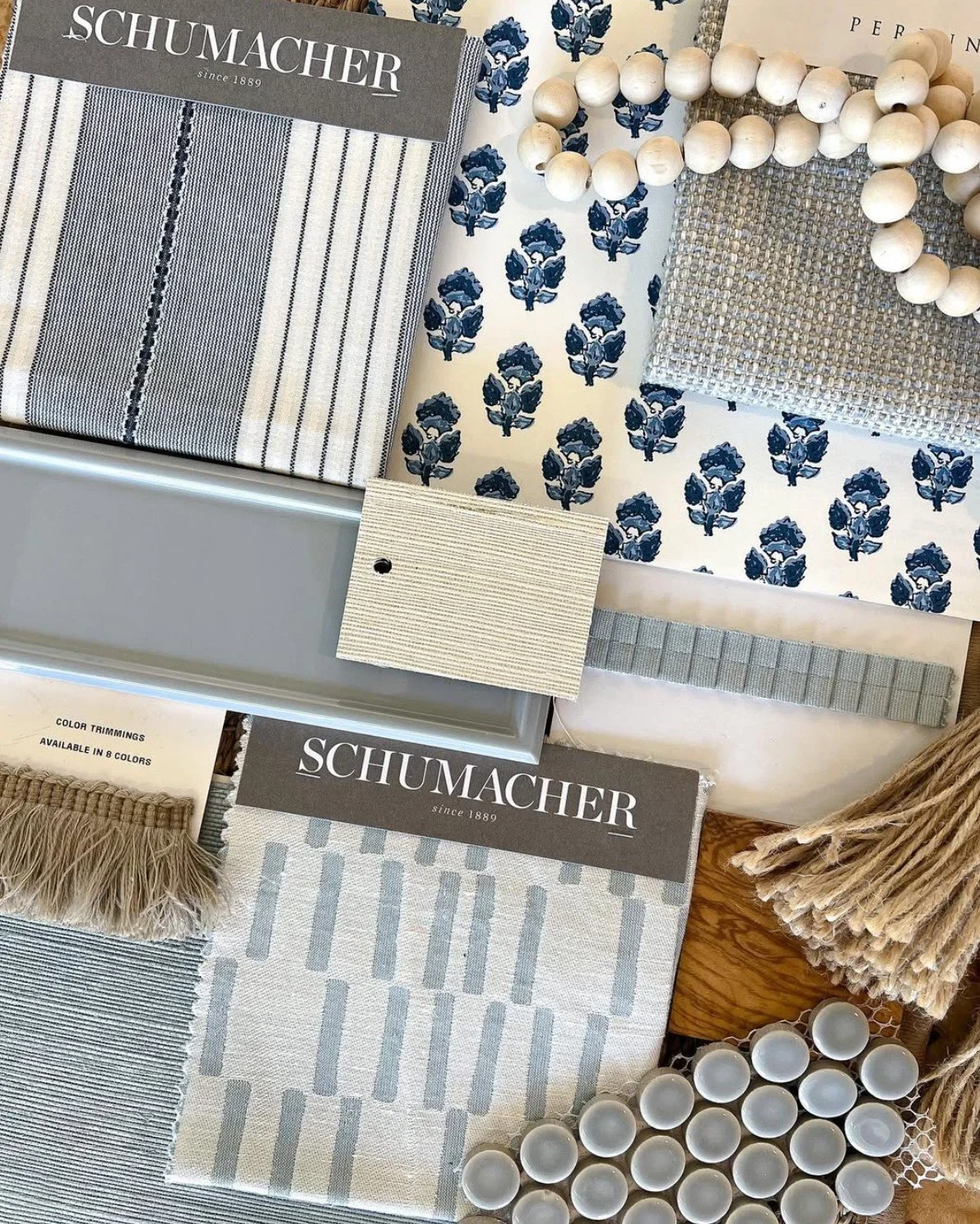 blue palette flat lay of textiles, tiles and wallpaper