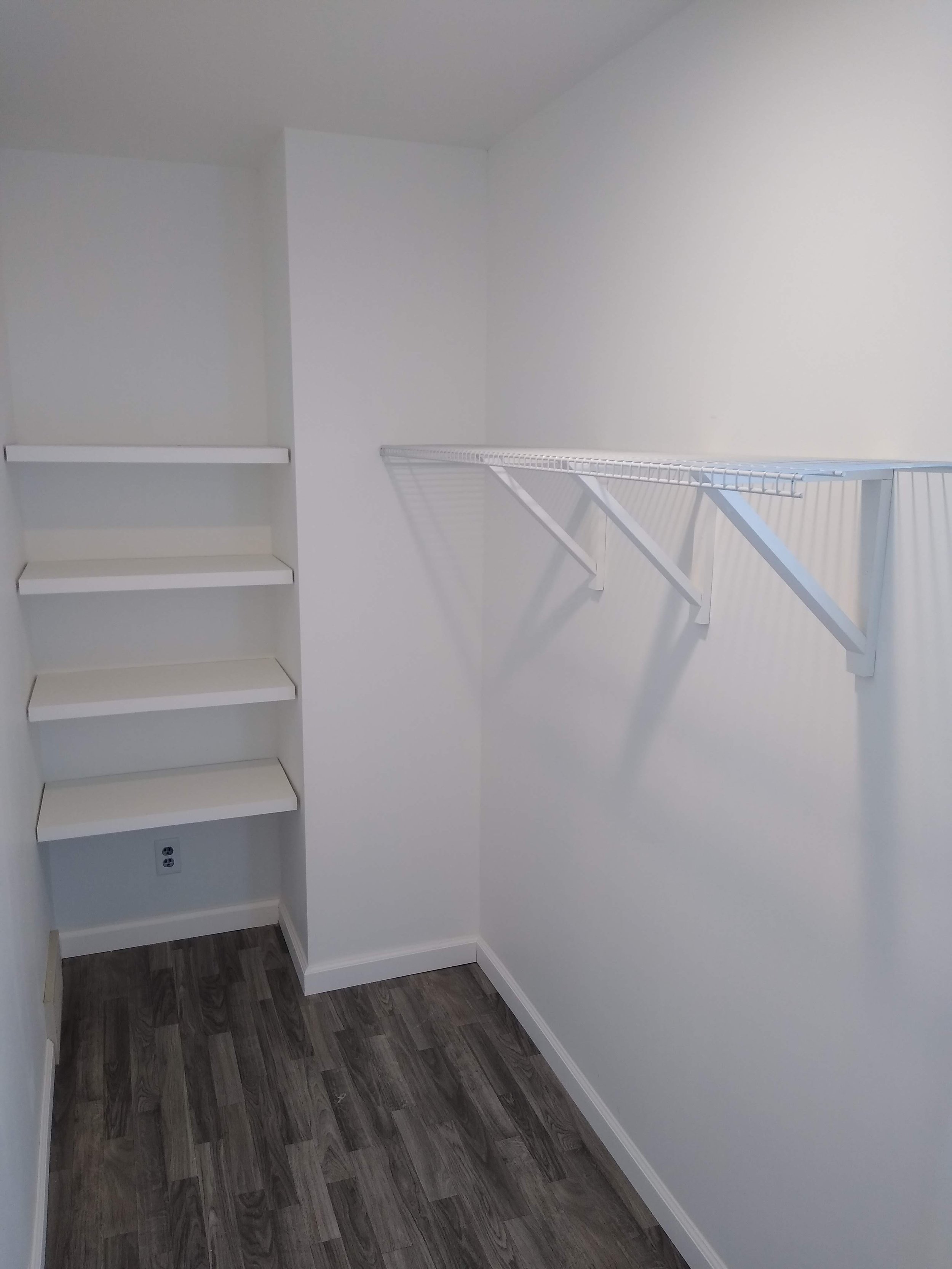 Closet with LVP flooring, trim, wire shelving 