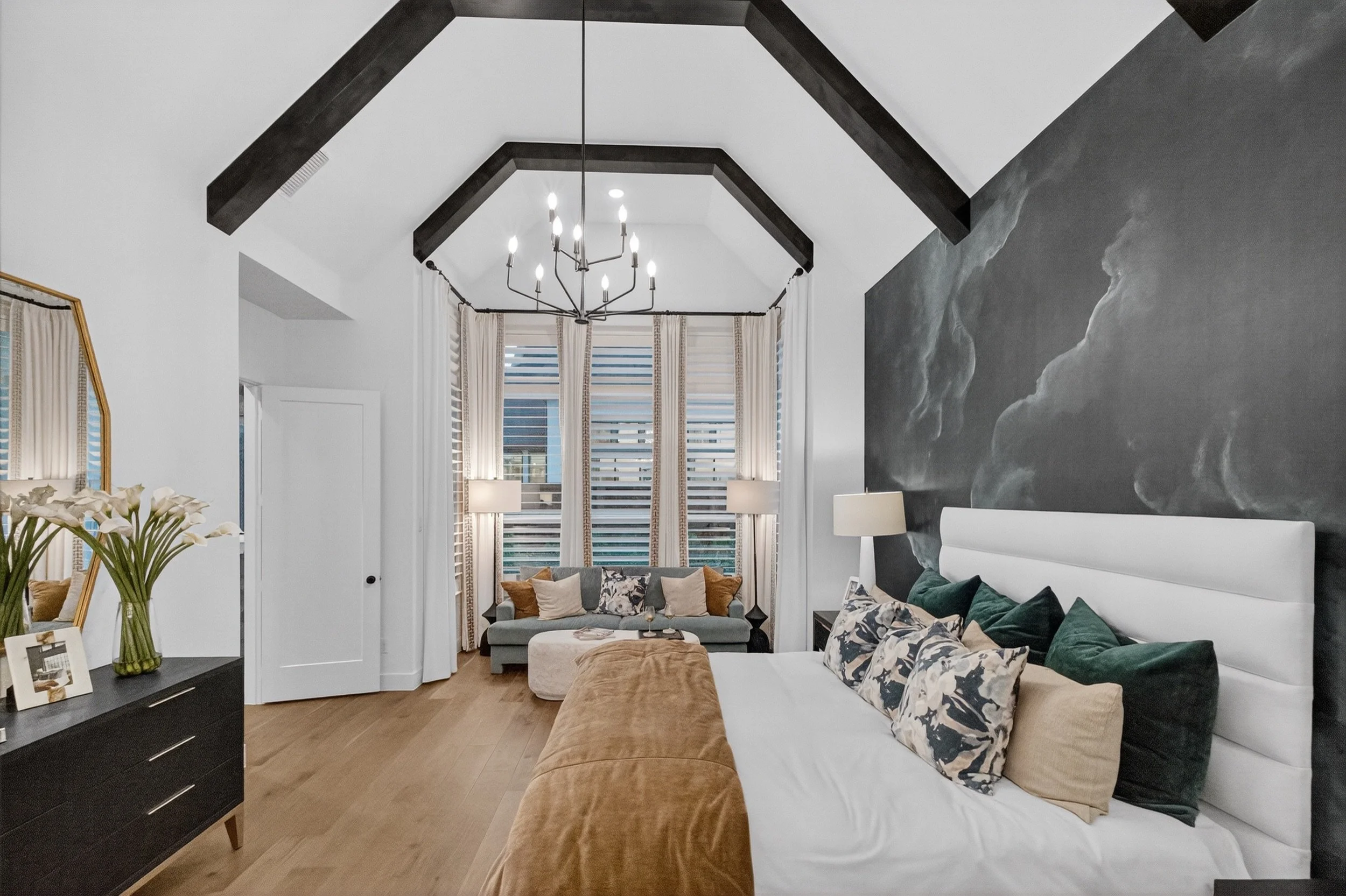 Maricopa AZ real estate photography prep example: primary bedroom with made bed and clear surfaces
