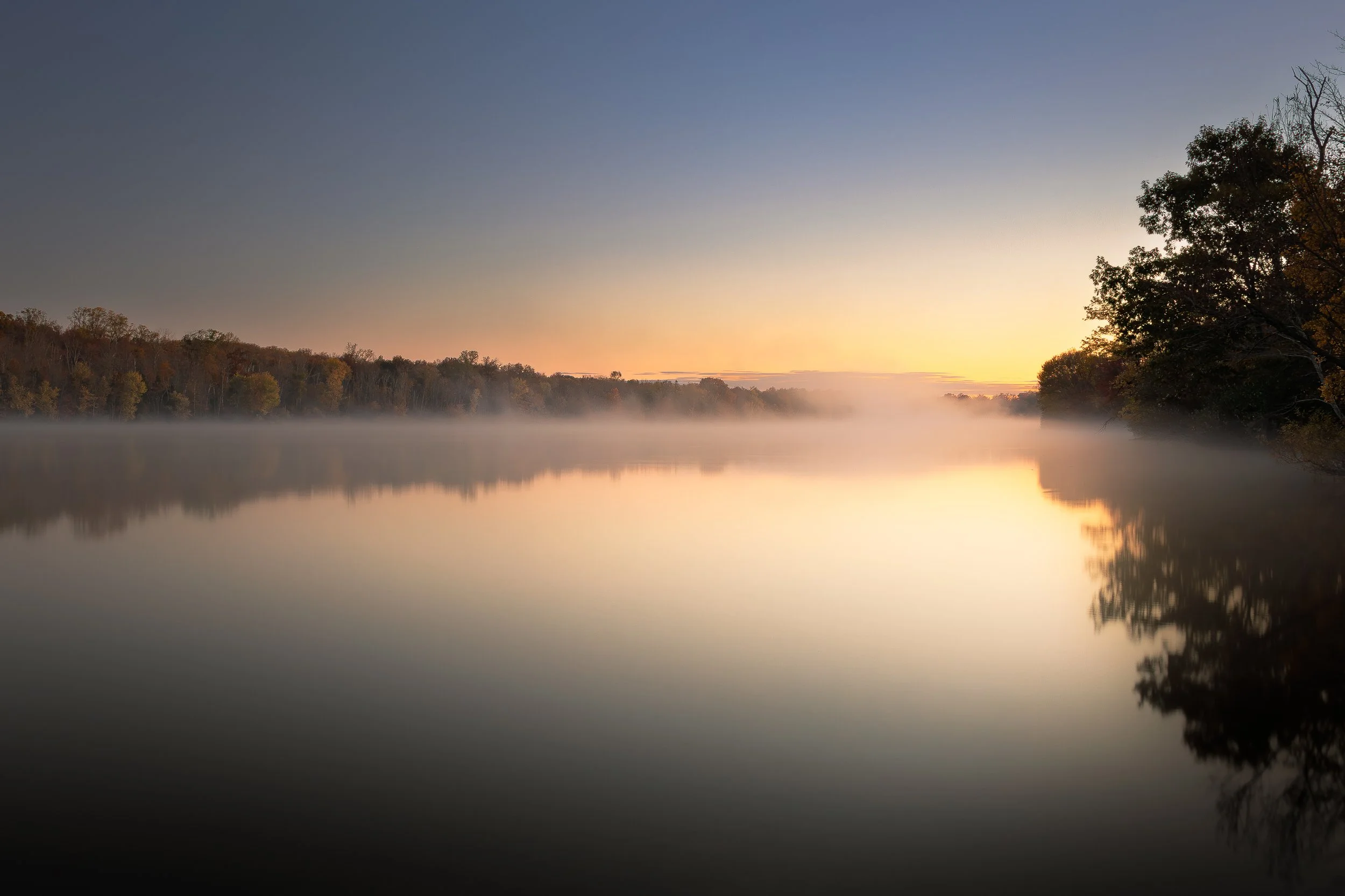 Light’s Reflective Canvas
The mist, present and strong, slowly yields to the morning light.