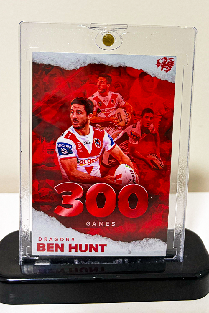 A commemorative display for Ben Hunt of the Dragons, celebrating his 300 rugby games. The display features multiple images of Hunt in his team uniform, holding a rugby ball, with the text '300 GAMES' and his name at the bottom.