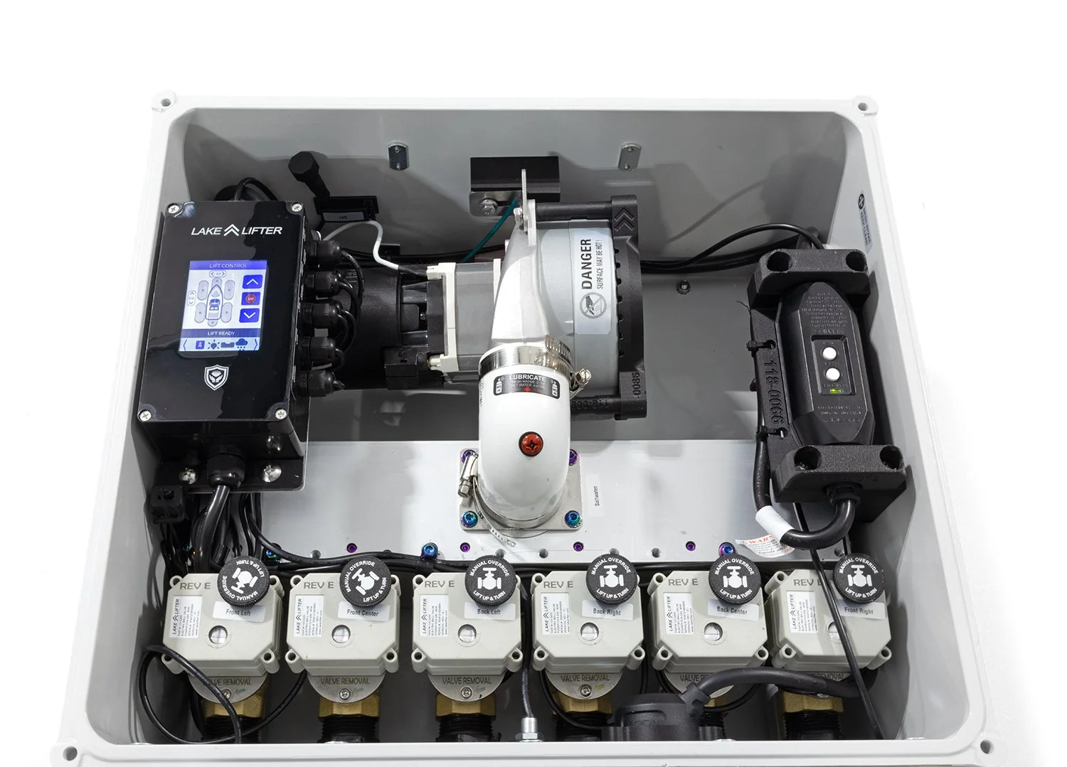 Inside of a control box with various electrical components, including a Lake Lifter control panel, a motor, and multiple valve actuators labeled for different positions.