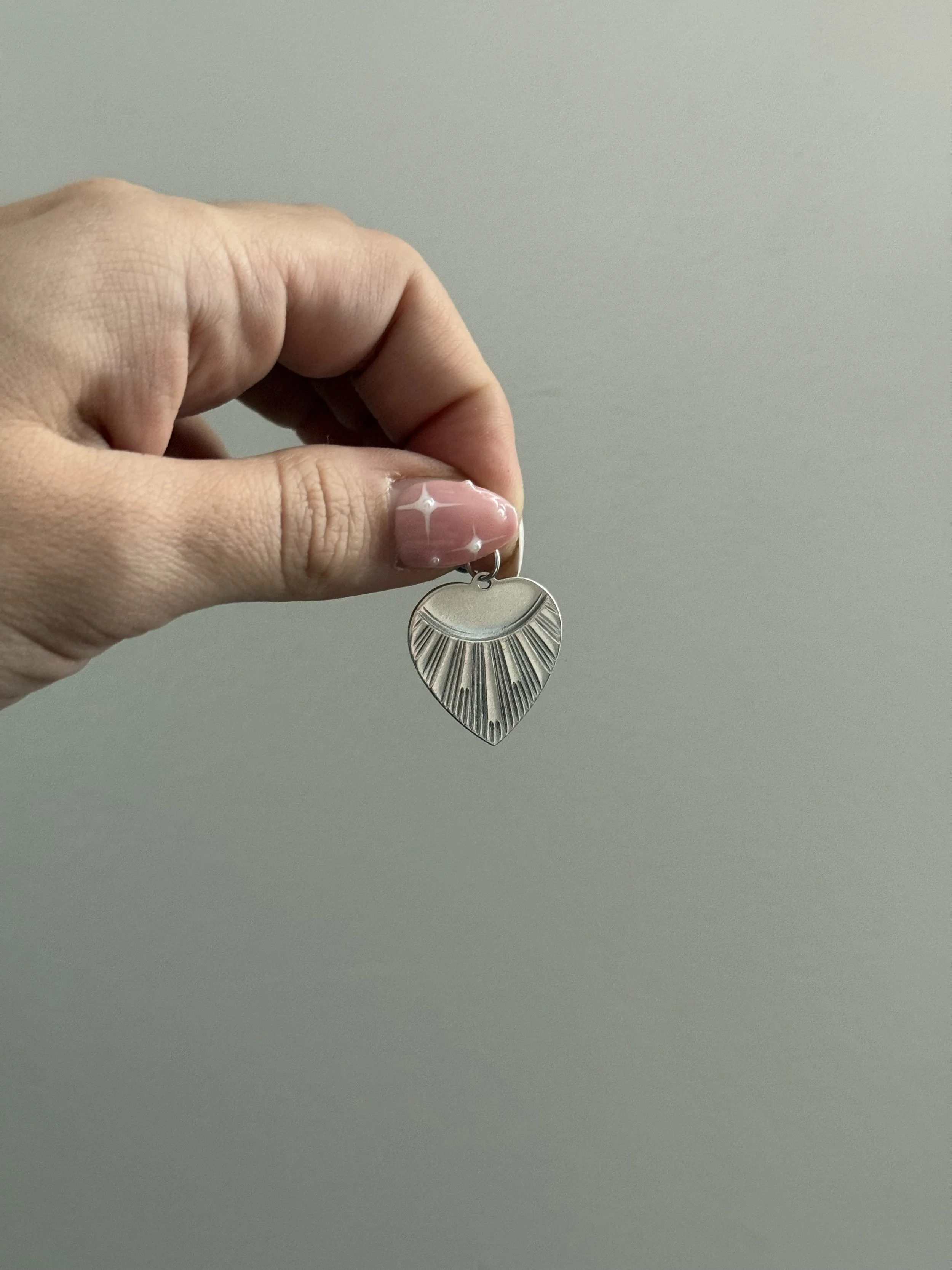 engine turned heart charms