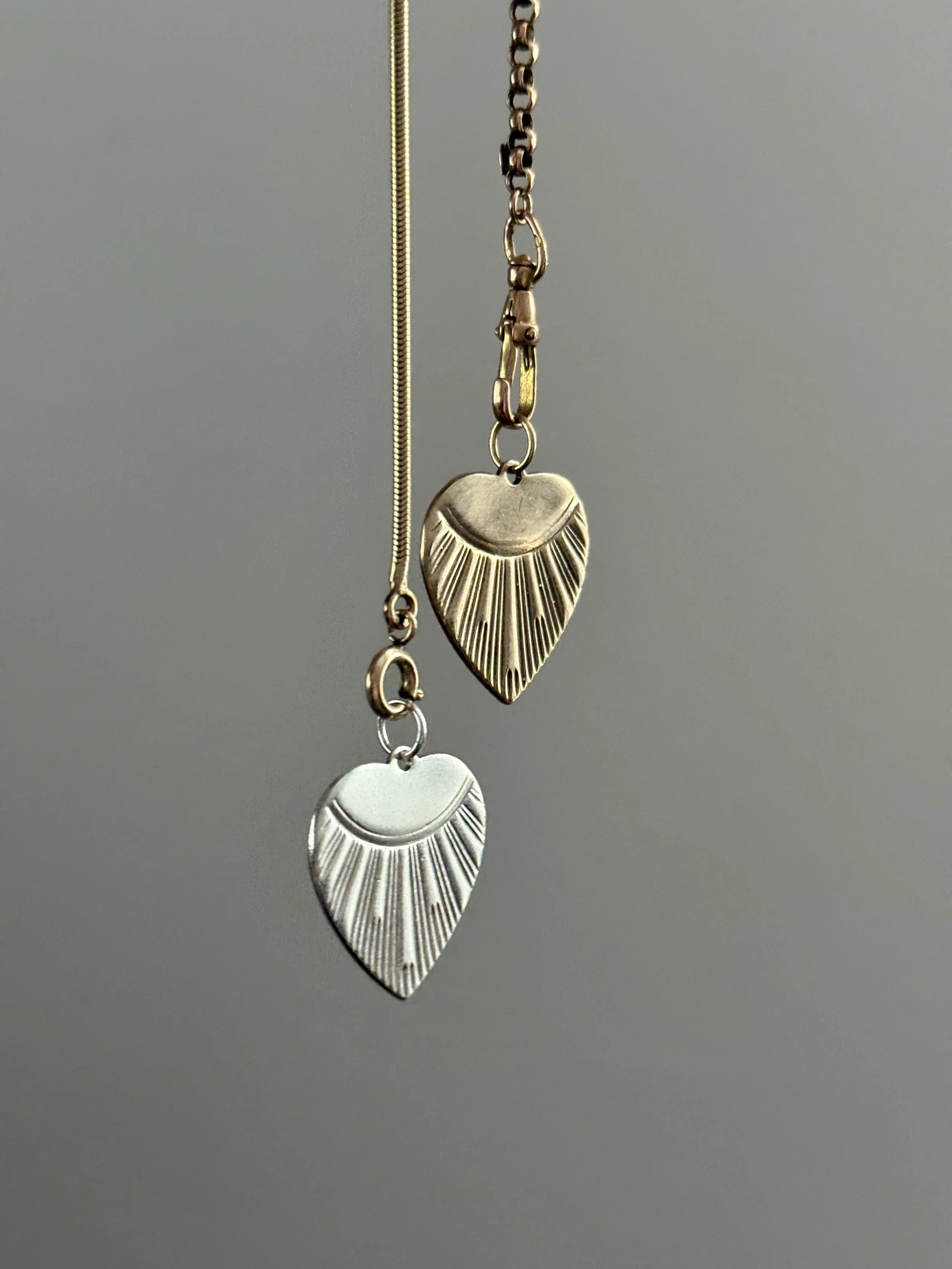 engine turned heart charms