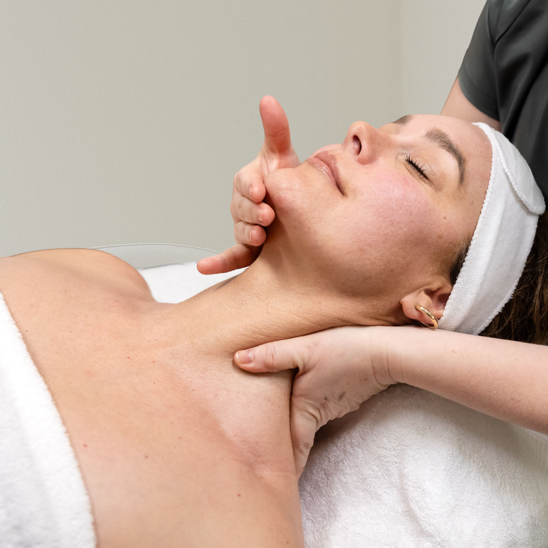 A woman receiving a facial massage at Rejuva skincare clinic.
