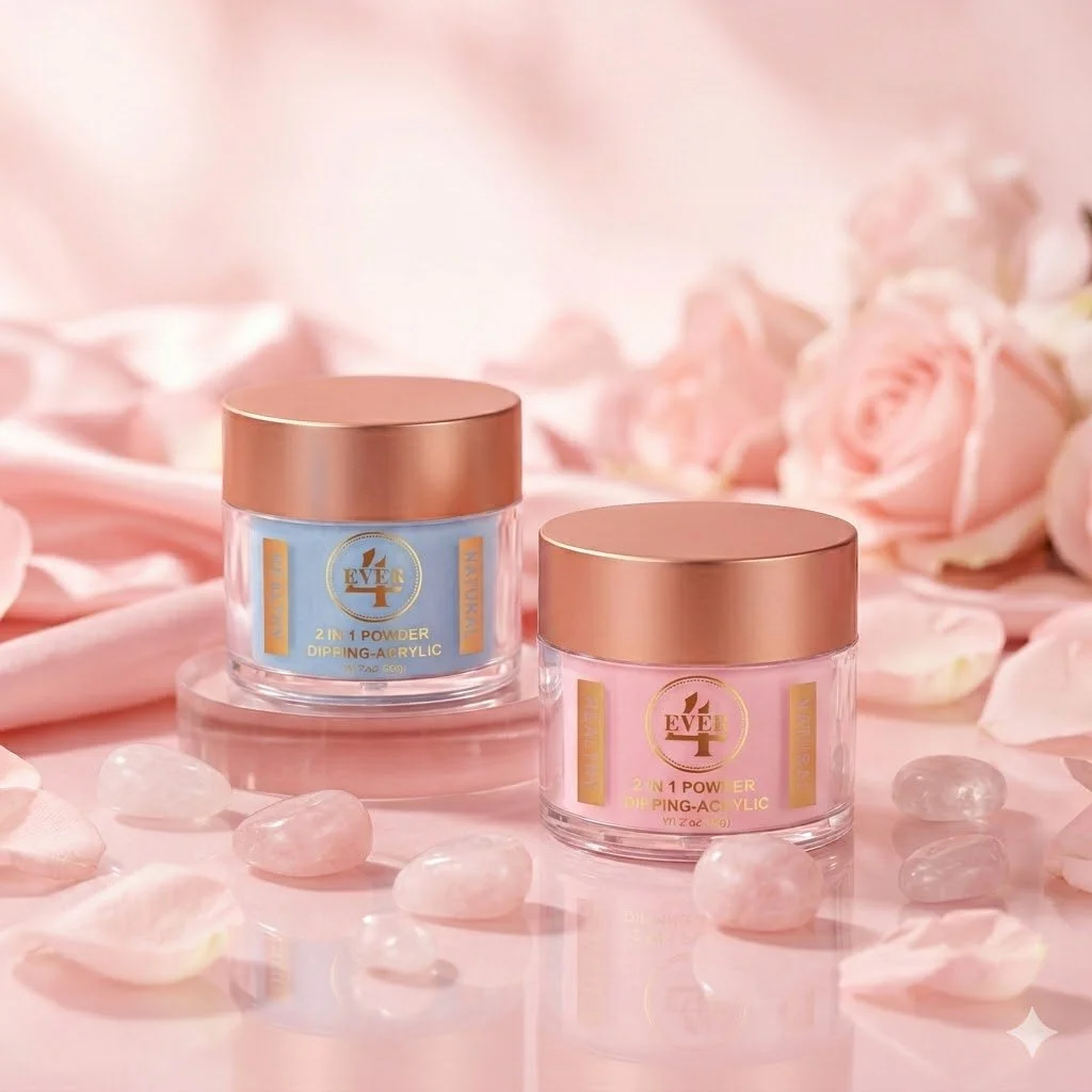 Two cosmetic jars labeled '2 in 1 Powder Diffing Acrylic' with gold lids on a pink surface, surrounded by pink rose petals and small pink gemstones, with pink roses in the background.