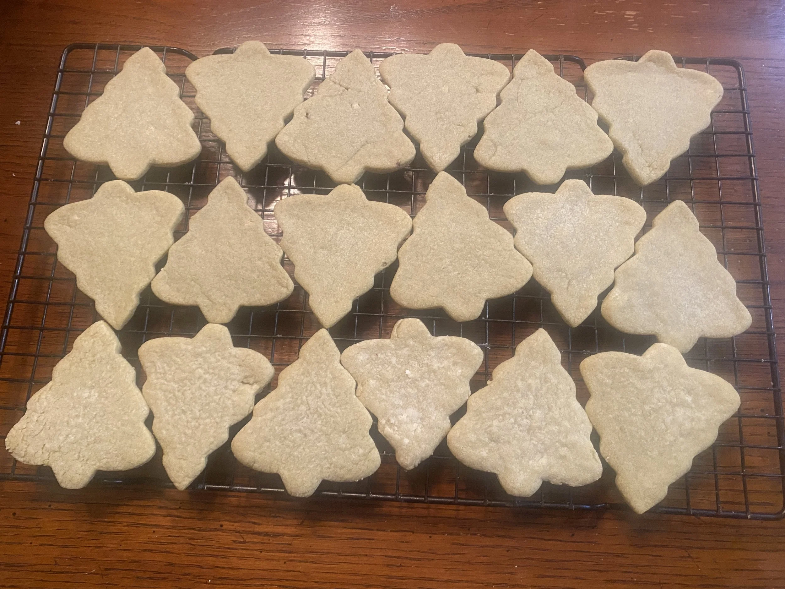 Home-baked pistachio cut-out cookies shaped like trees, made with locally sourced Wisconsin ingredients.