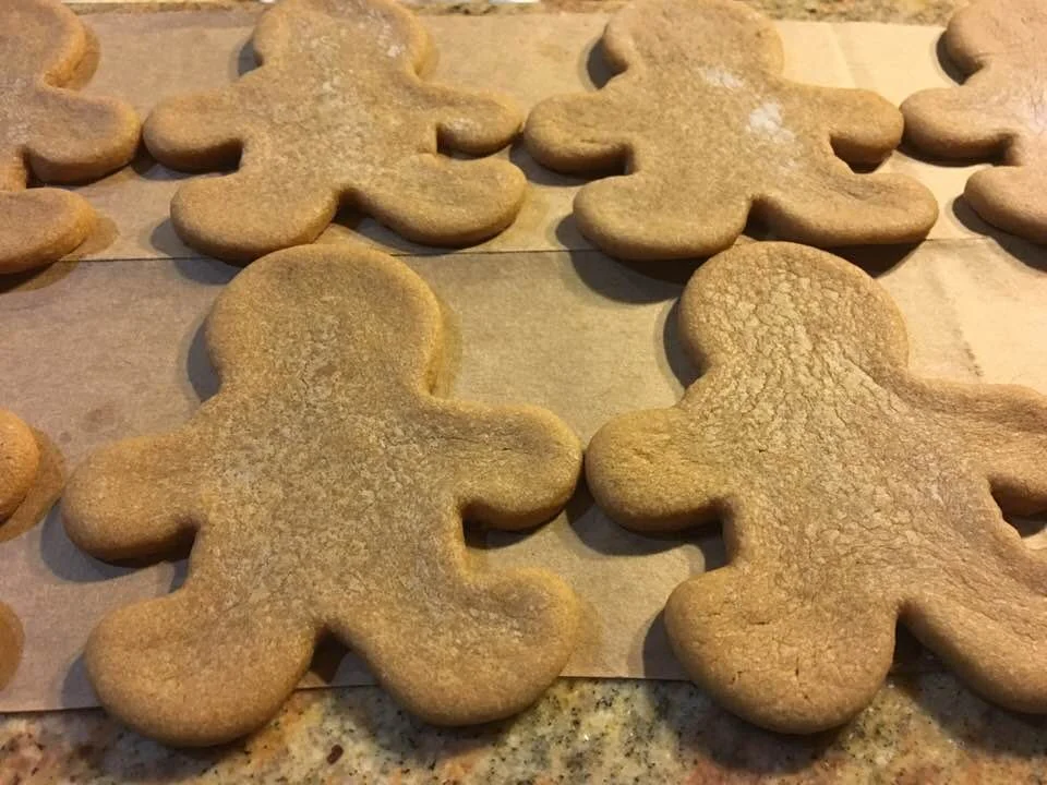 Gingerbread man-shaped cut-out cookies made by Wisconsin Cottage Bakery Twelve Moons Baking