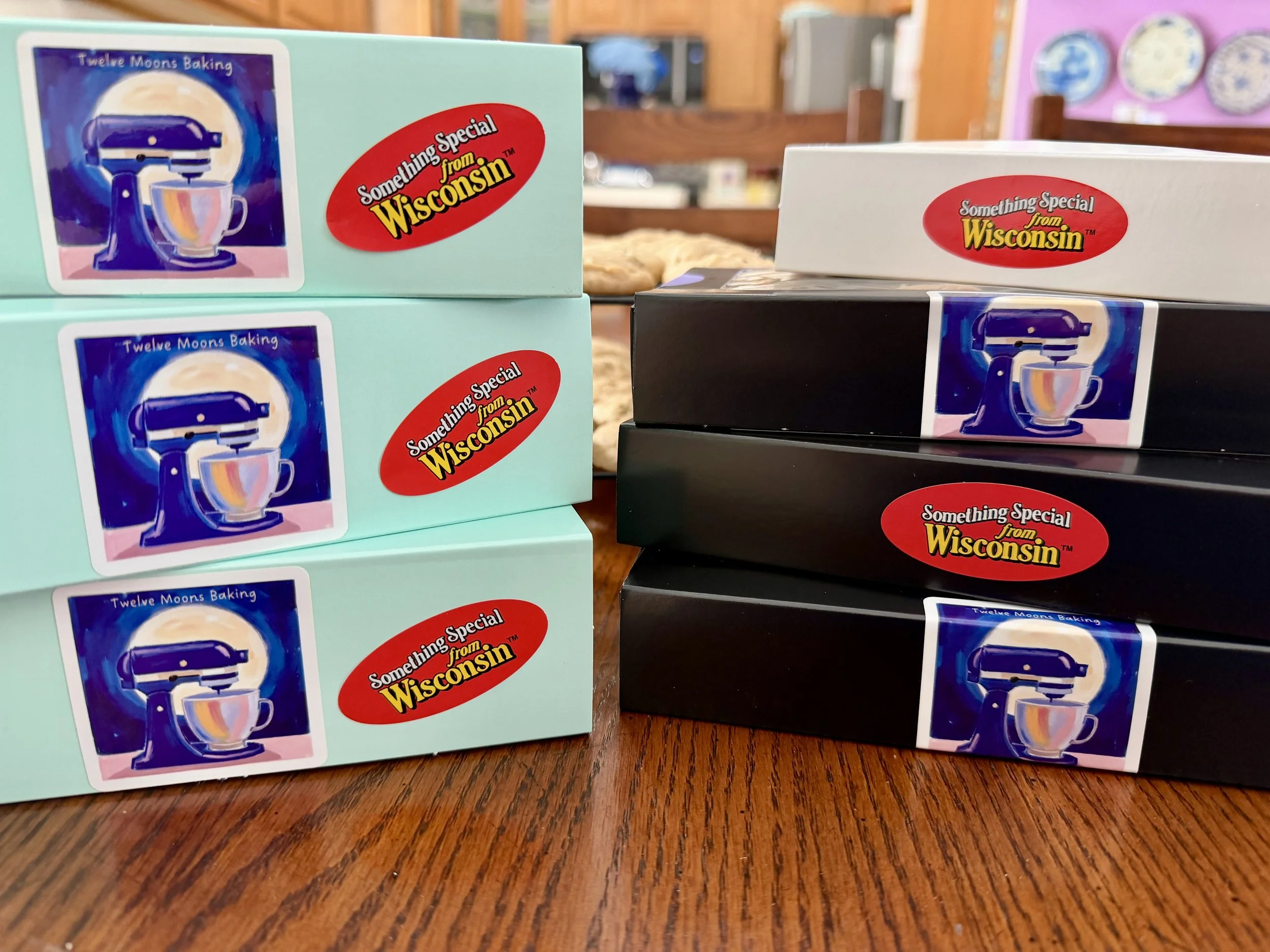 Three Full Moon boxes, three Half Moon boxes, and one Quarter Moon box of the Cookie of the Month.