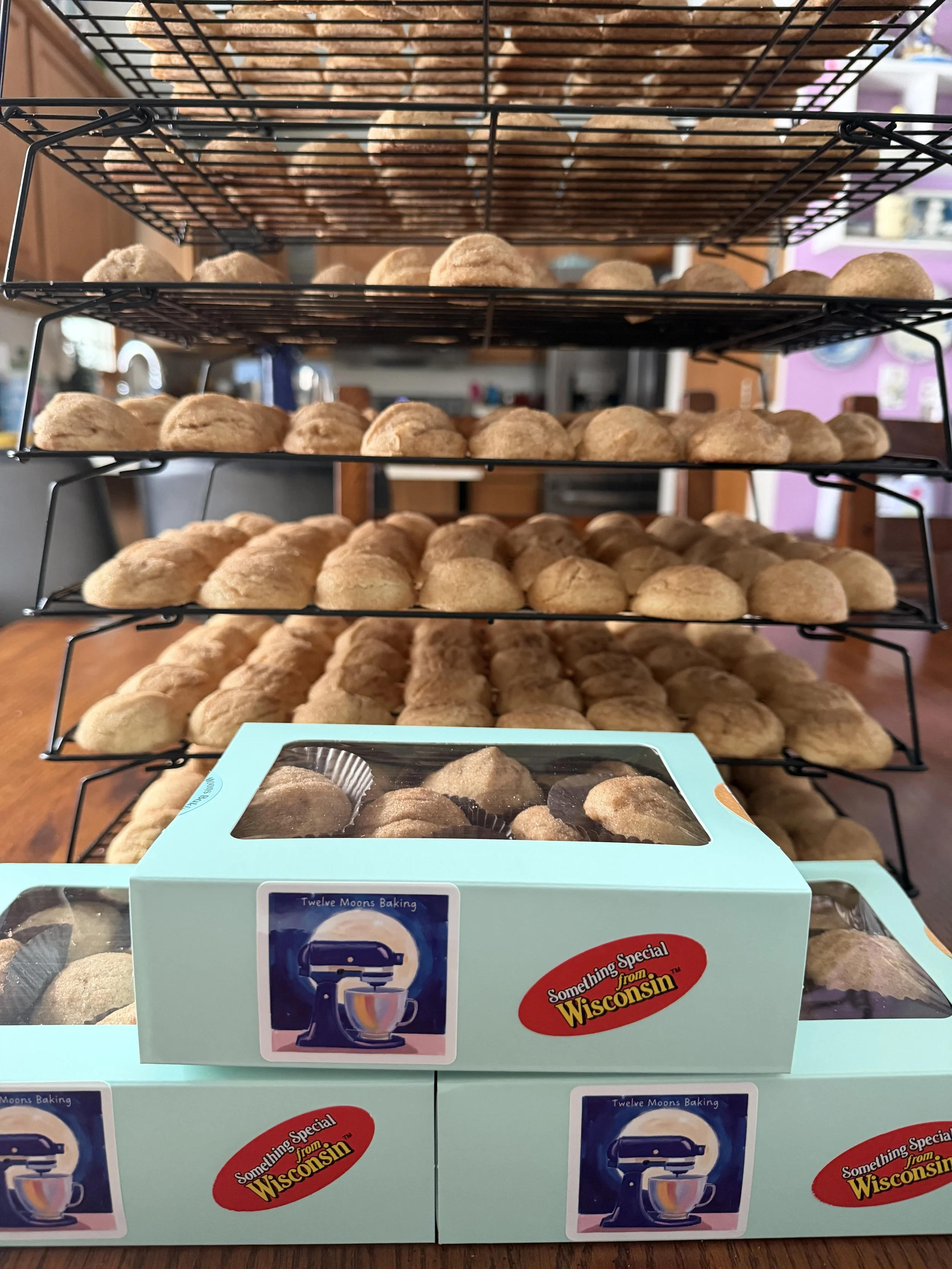 A stack of three boxes, each containing 18 home-baked cookies from Wisconsin cottage bakery Twelve Moons Baking LLC