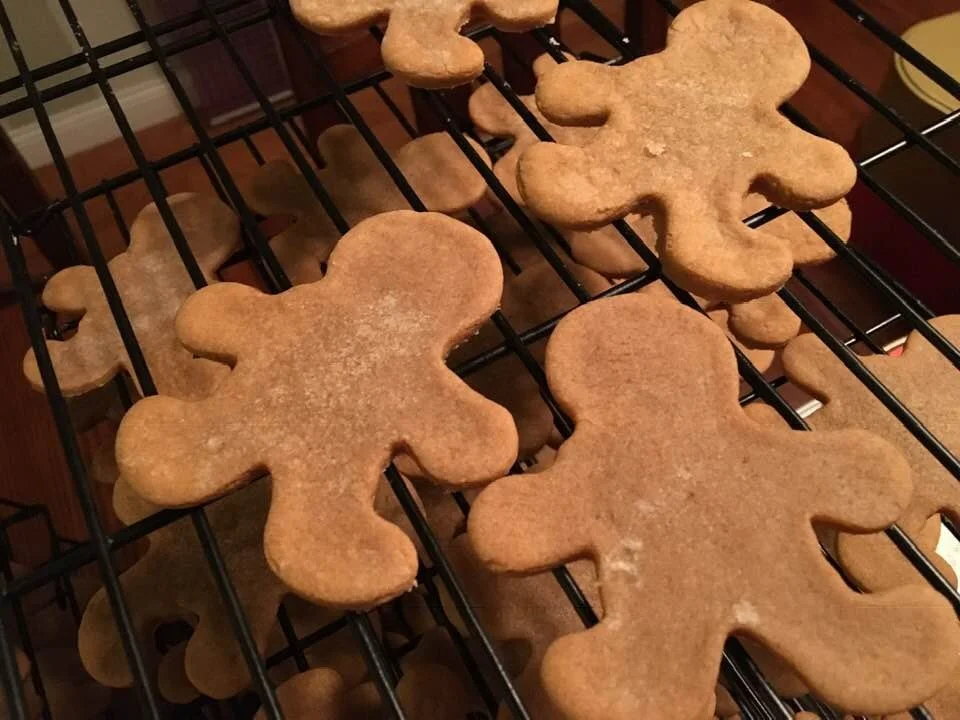 Gingerbread man-shaped cut-out cookies made by Wisconsin Cottage Bakery Twelve Moons Baking