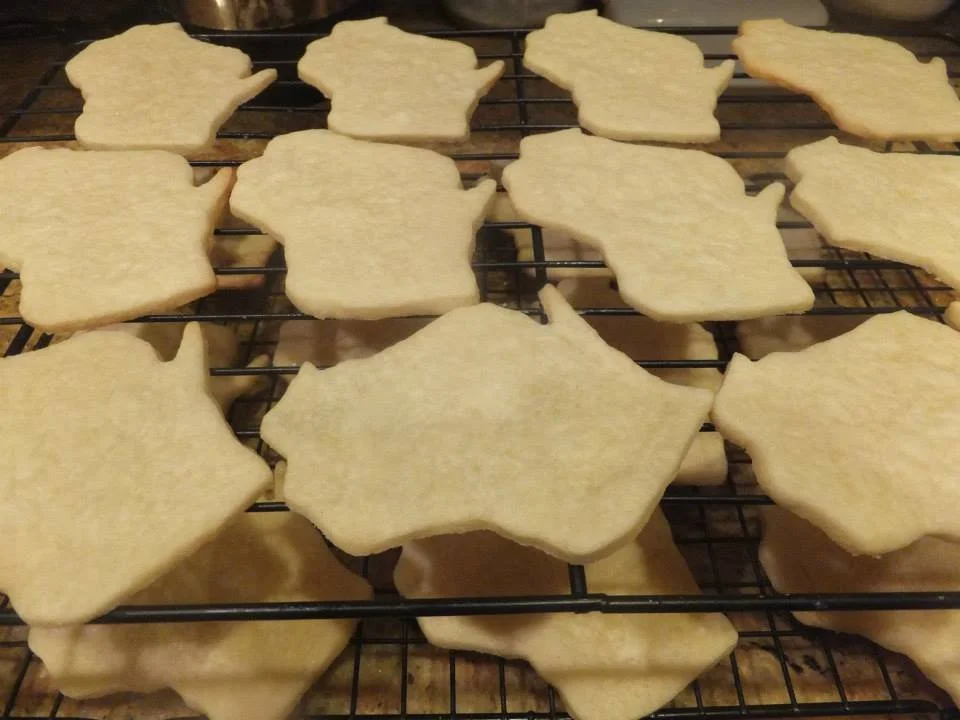Wisconsin-shaped cut-out cookies made by Wisconsin Cottage Bakery Twelve Moons Baking