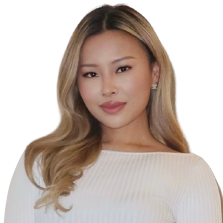 Portrait of a woman with long blonde hair, wearing a white top, smiling slightly.