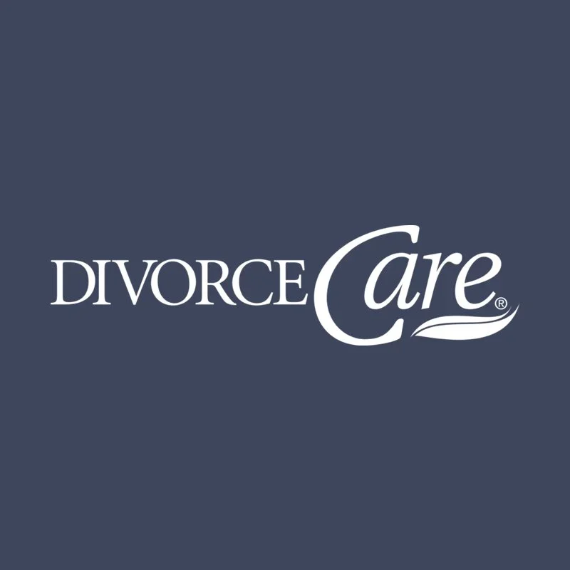 Logo for Divorce Care with stylized text and a leaf design on a dark background.