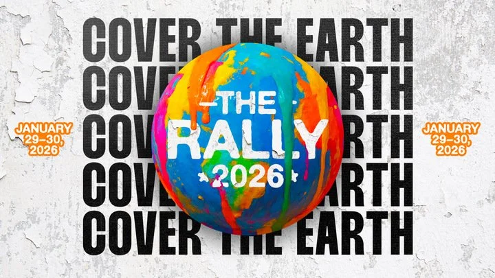 Poster for The Rally 2026 event, featuring a colorful globe with painted continents and the words 'The Rally 2026'. Repeated text 'Cover the Earth' is in the background, and event dates January 29-30, 2026 are on the sides.