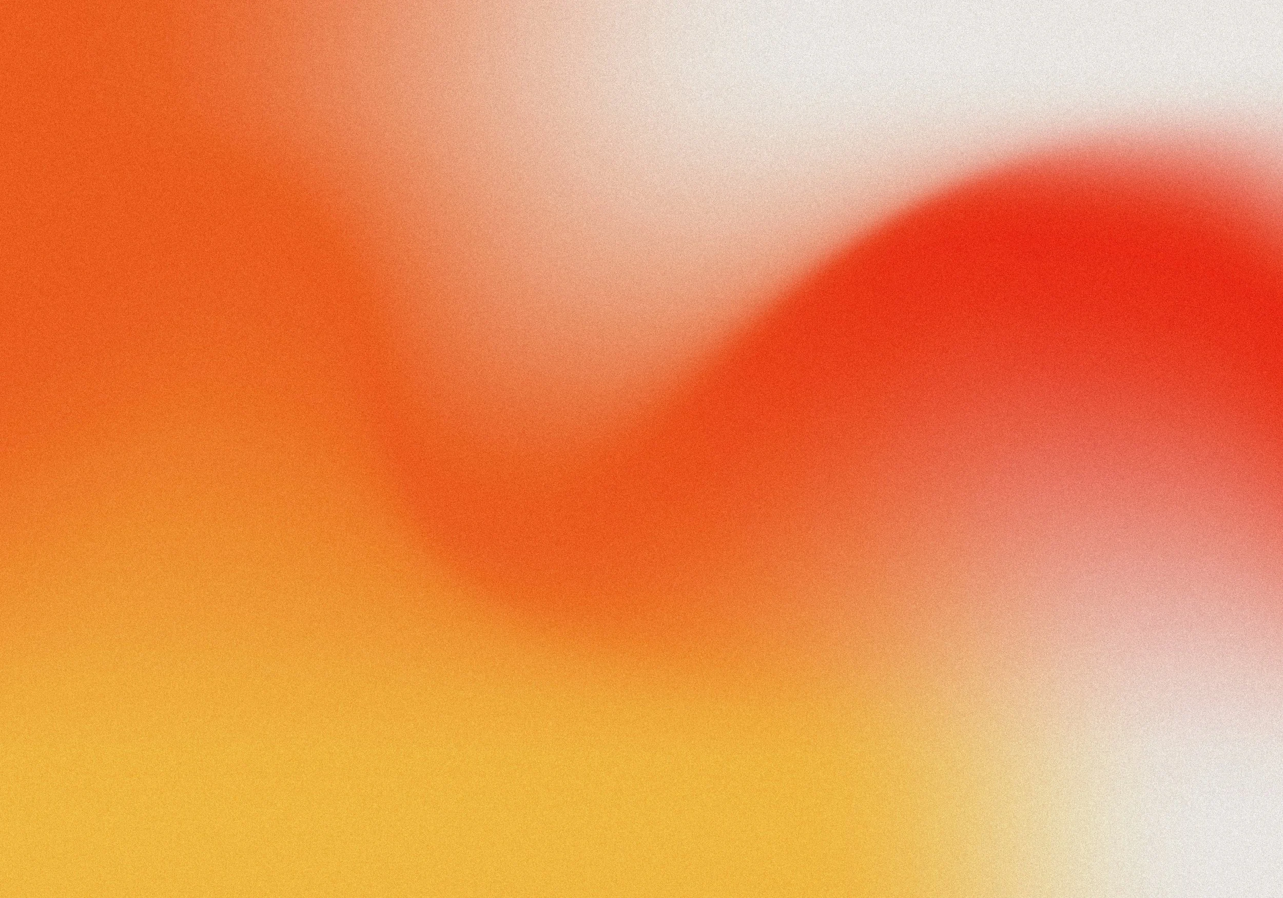Blurred abstract background with shades of orange, red, yellow, and white.