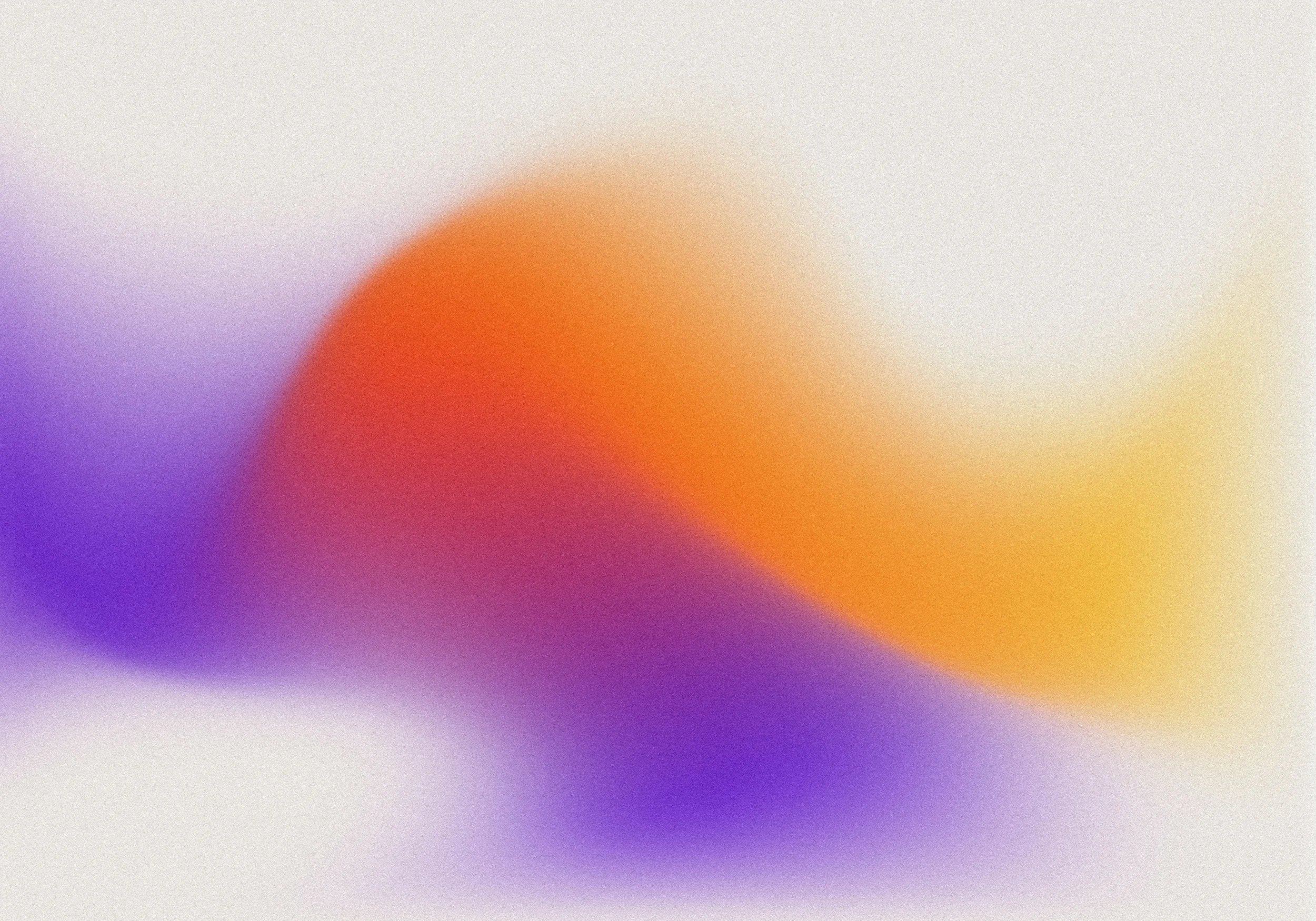 Blurred abstract colorful background with shades of purple, orange, yellow, and white.