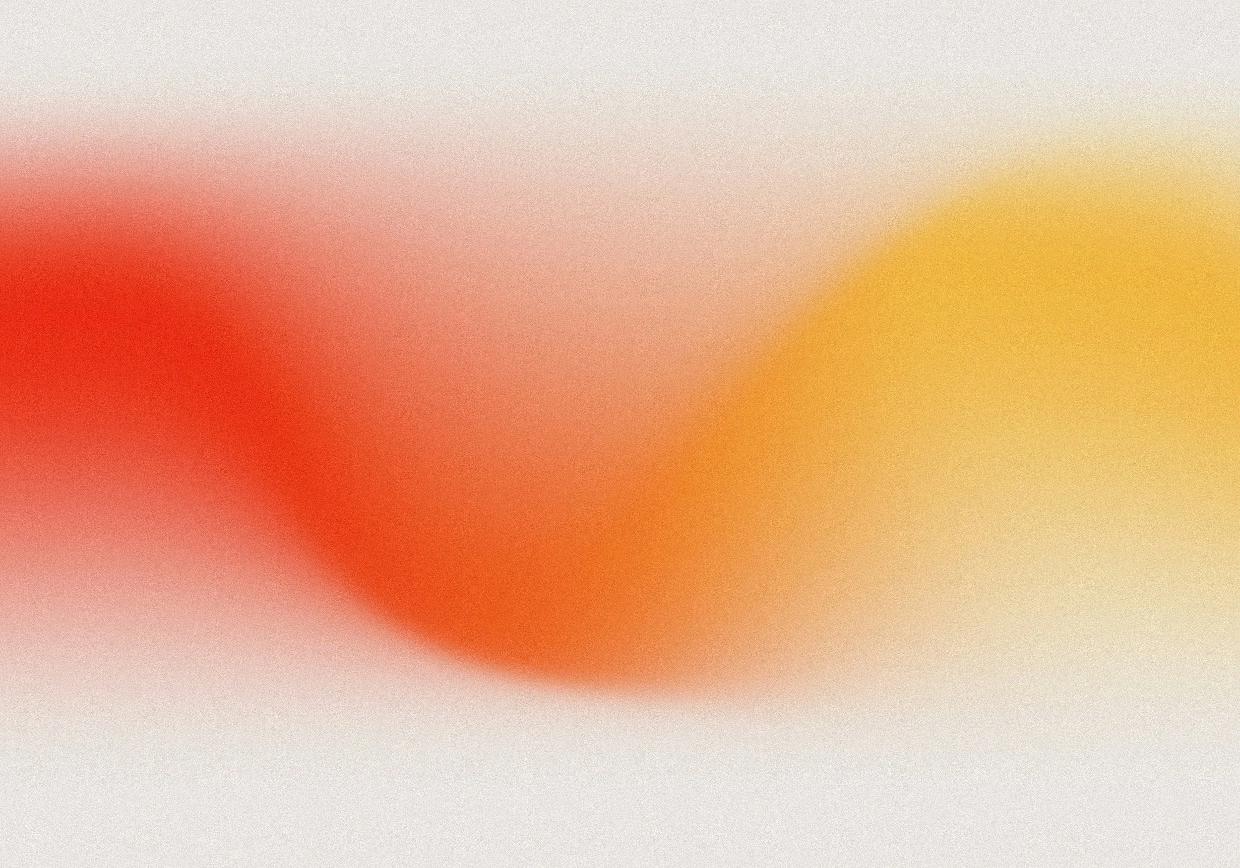 An abstract blurred image with red, orange, yellow, and white colors blending together.