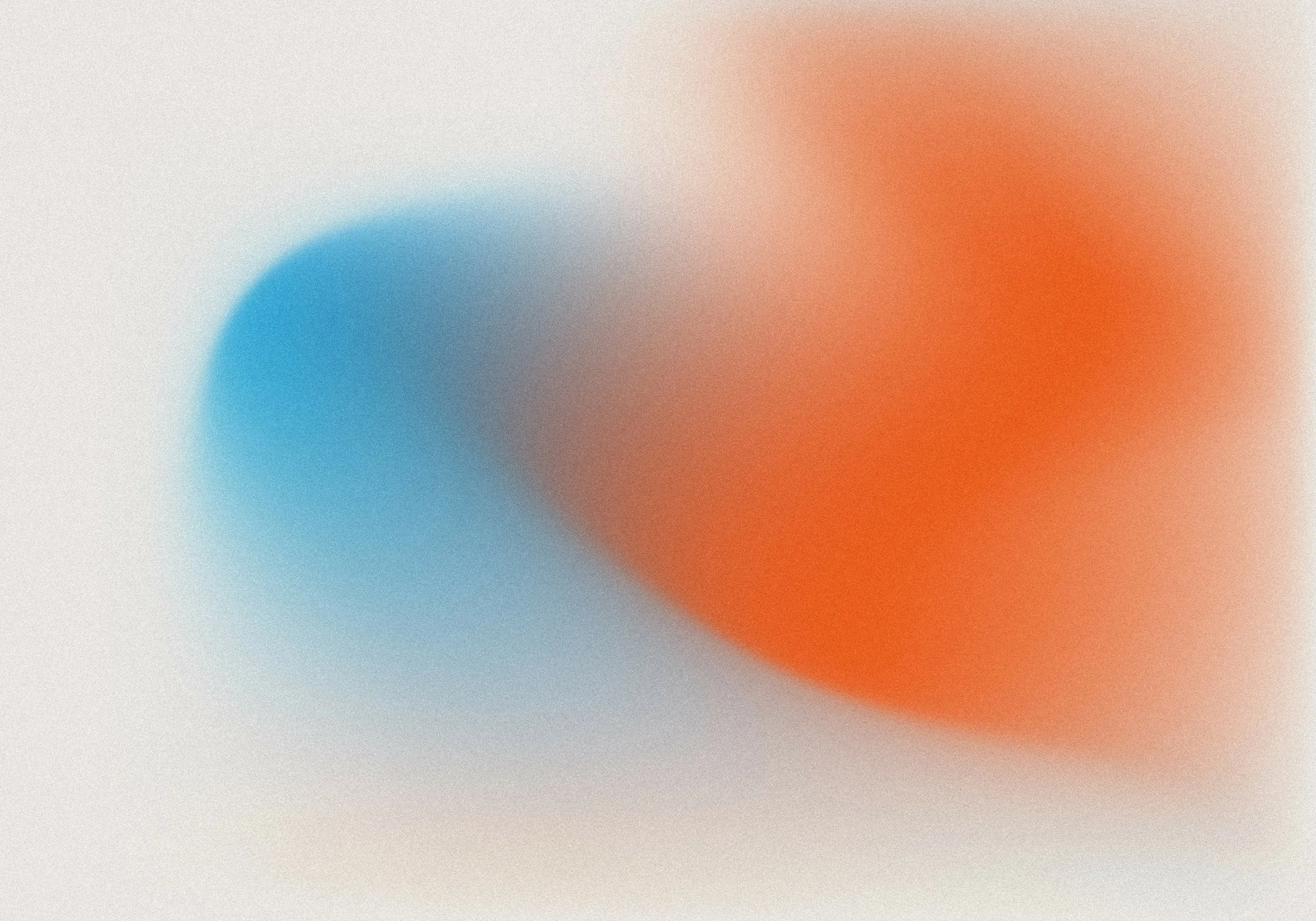 Blurred abstract image with blue and orange gradients.