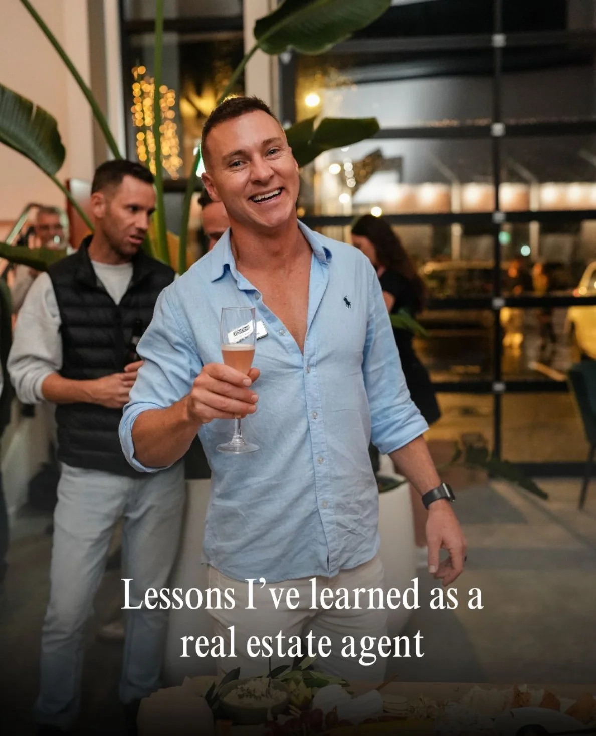 Christian Newman smiling with wine in hand