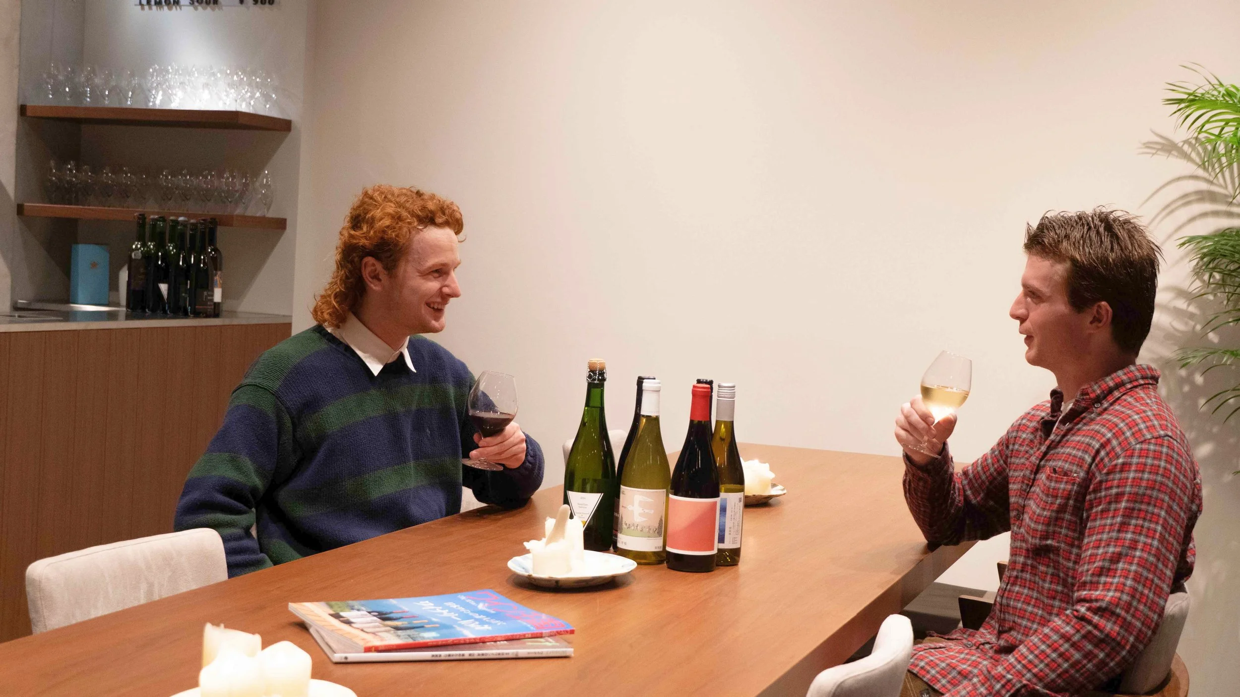 Guests enjoying glass of wine at THREE GRAPES