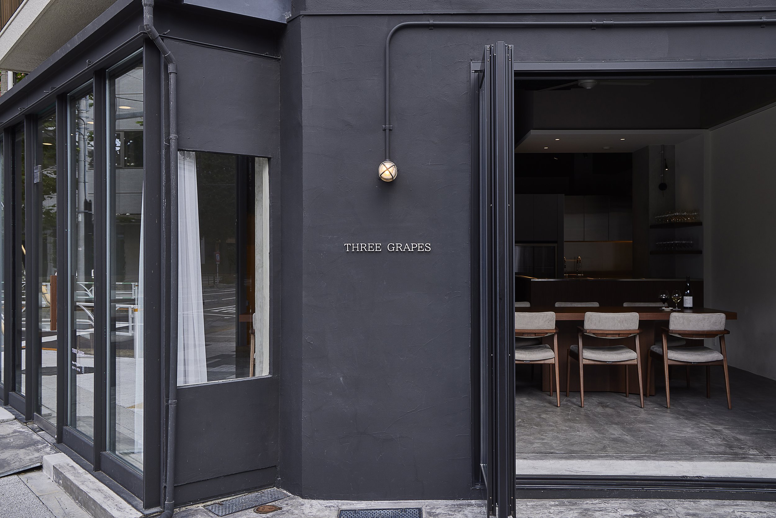Exterior of THREE GRAPES, a Japanese wine bar and cellar shop in central Tokyo.
