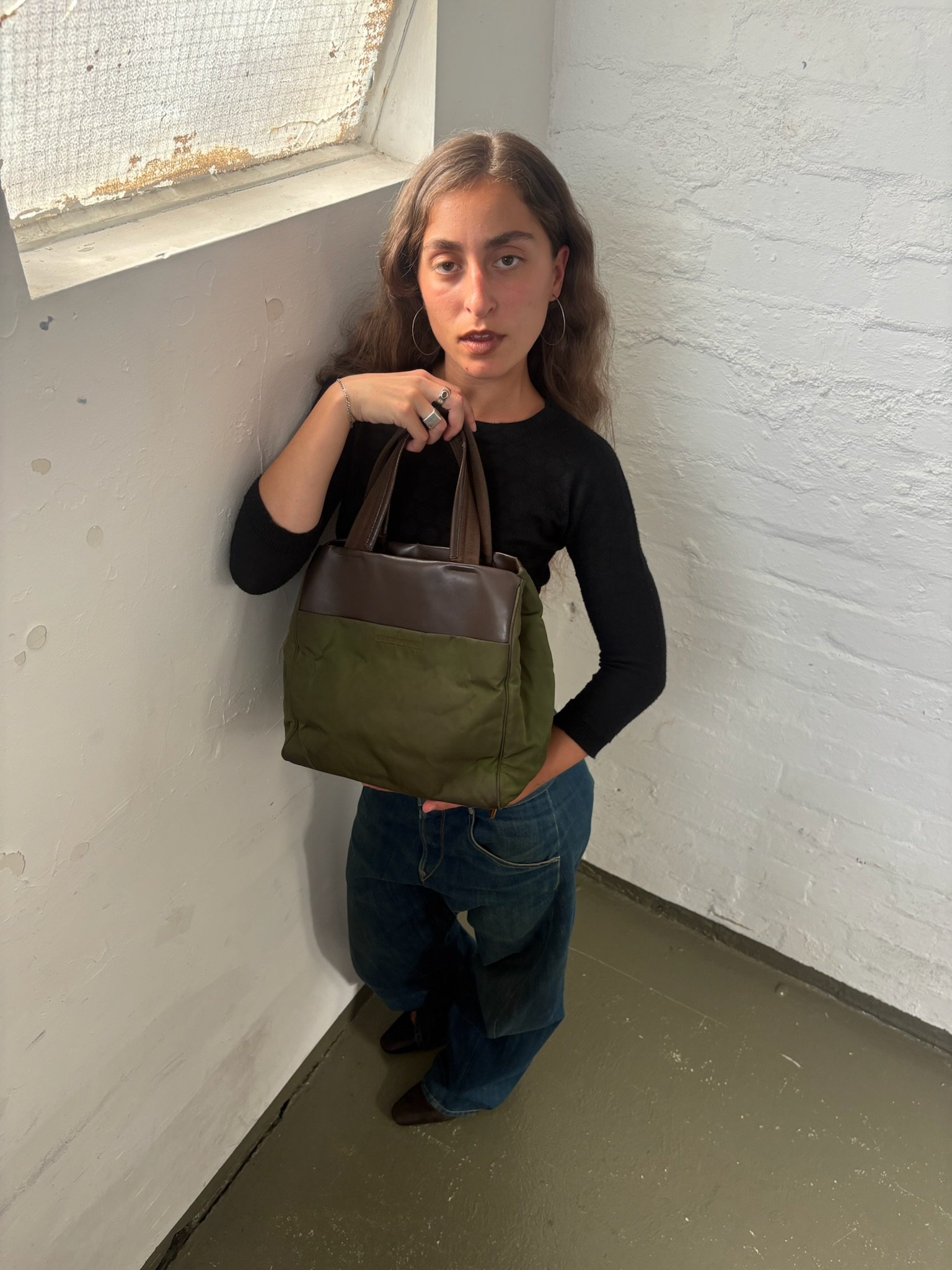 Comme des Garçons three-quarter knit paired with our Levi’s Engineered jeans, Prada Sport heels and Prada nylon handbag.