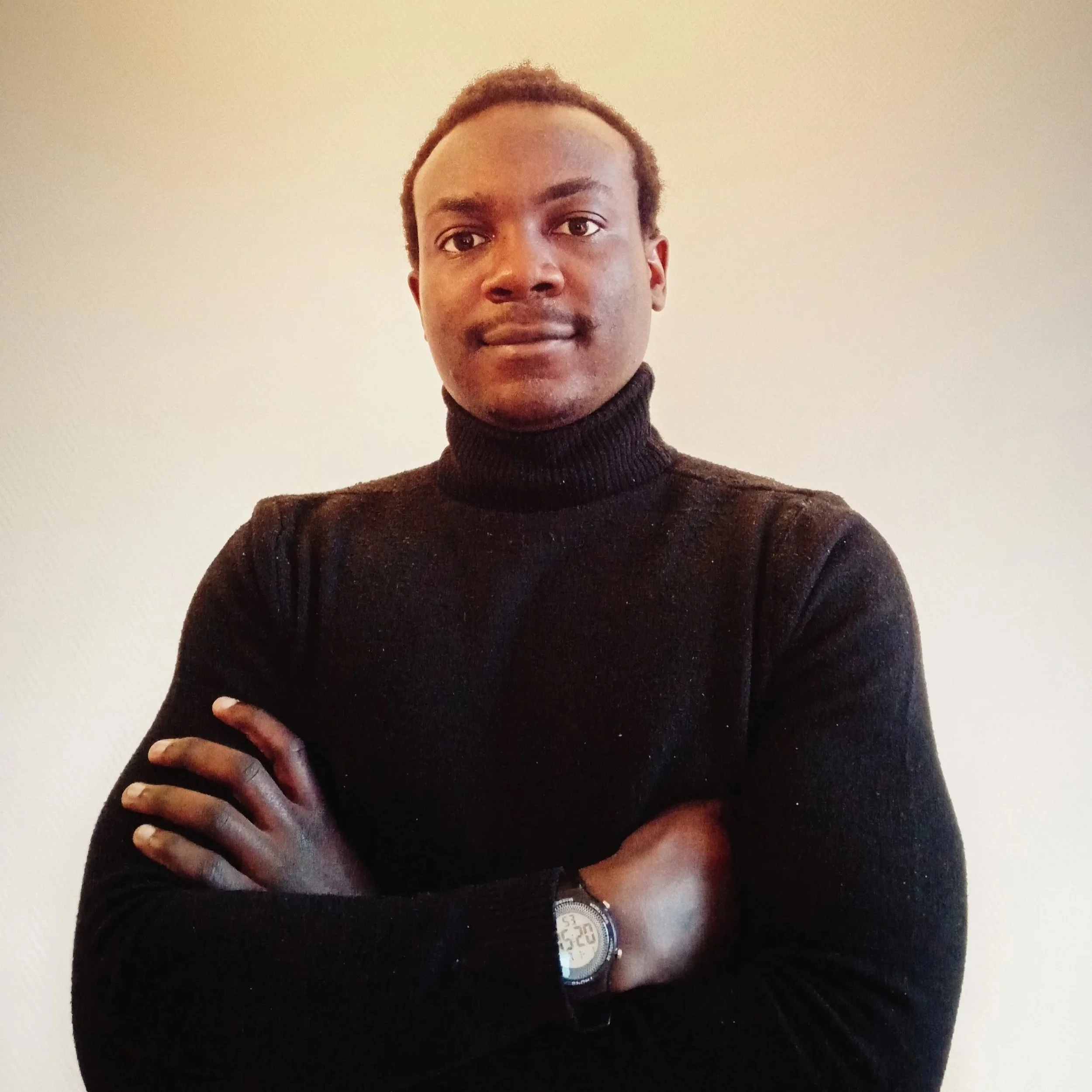 Smiling man with crossed hands