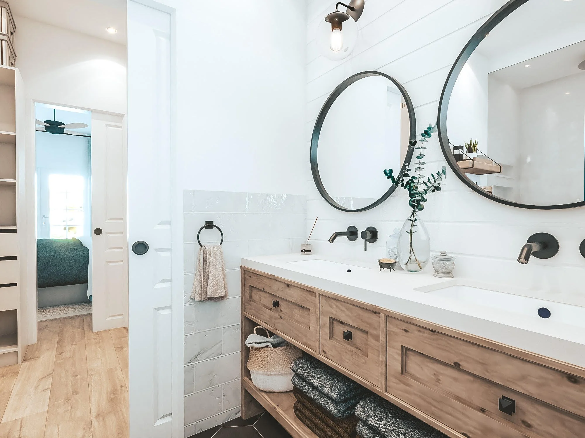 Soft coastal bathroom with freestanding tub and patterned tiles in a Hamptons-style design