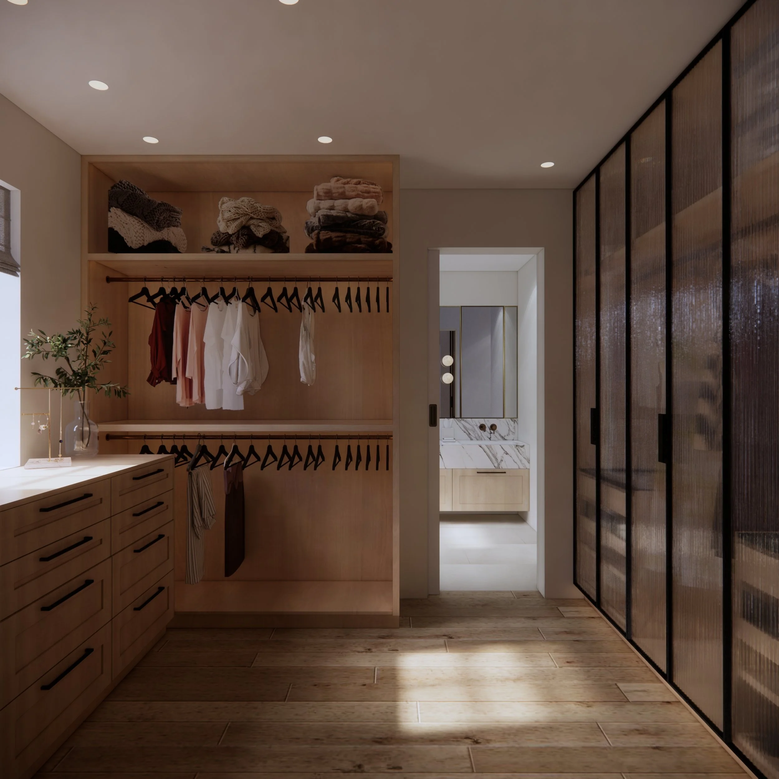 Custom walk-in robe with fluted glass wardrobes, integrated lighting and bespoke storage designed by TID Studio