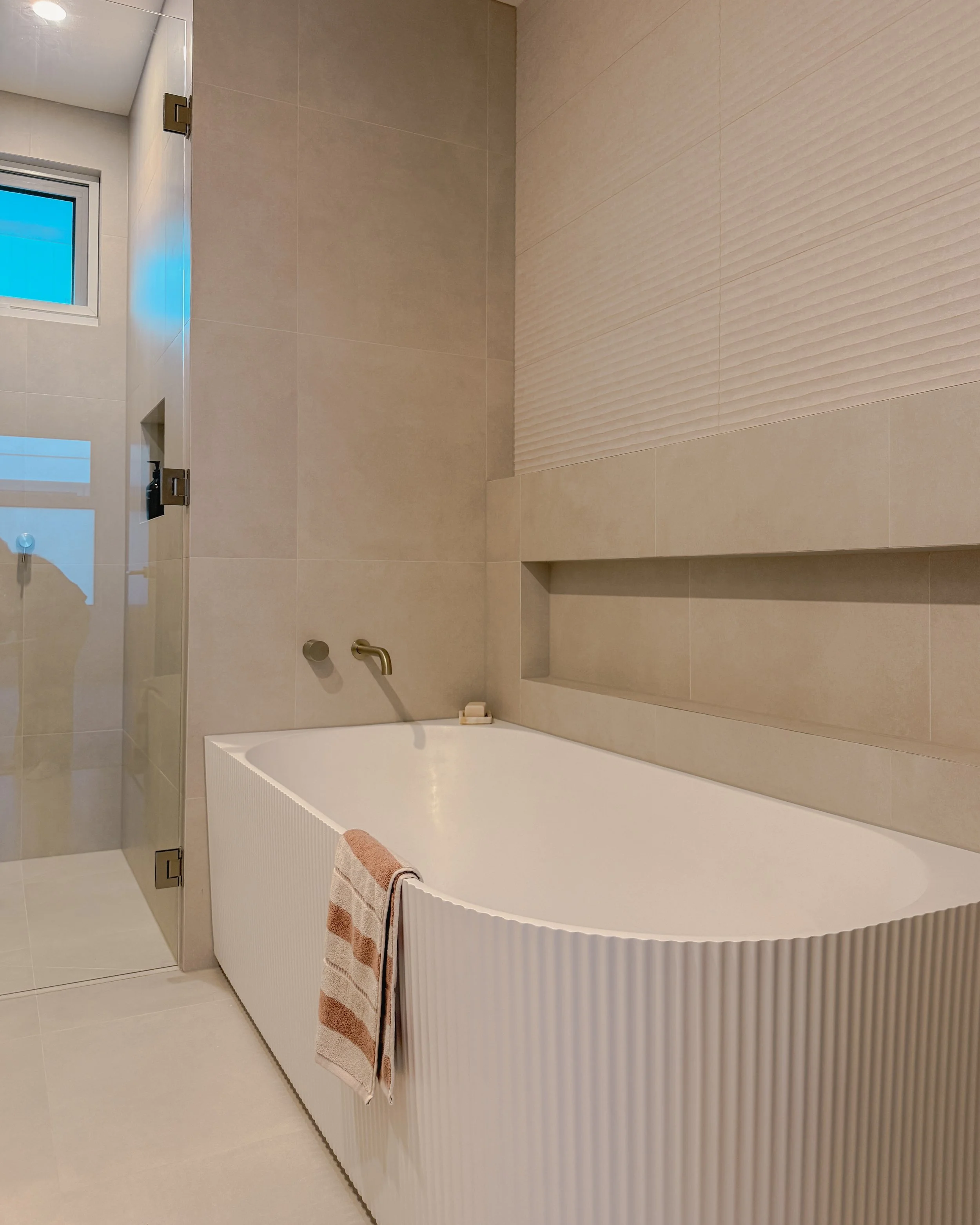 Contemporary bathroom with double vanity, enclosed shower and bathtub in Melbourne new-build. Designed by TID Studio, interior design in Sydney