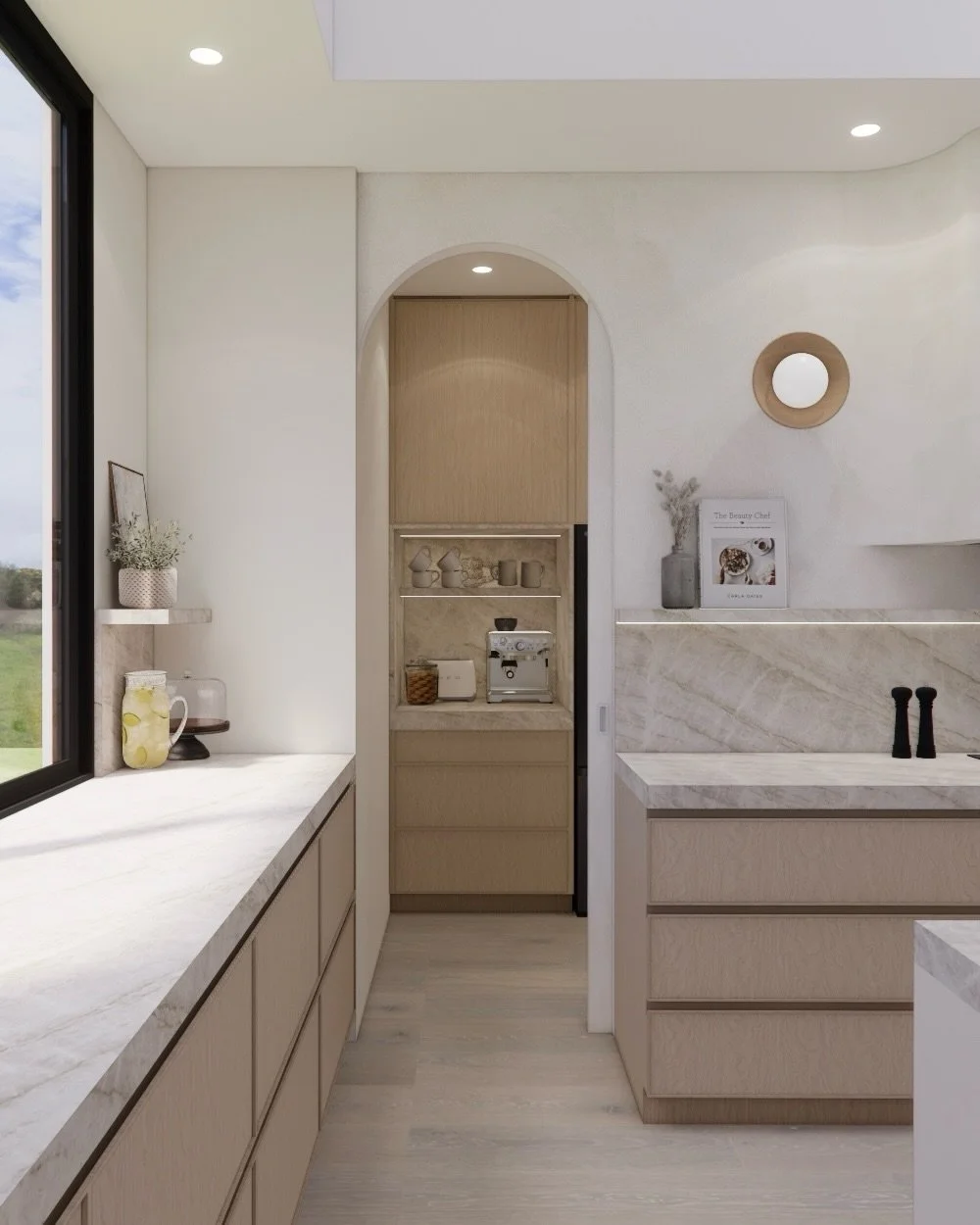 A kitchen designed as the true heart of the home &mdash; where gentle curves soften the architecture, warm timber cabinetry brings natural warmth, and layered stone surfaces add quiet elegance.
The oversized island invites everyday moments and easy e