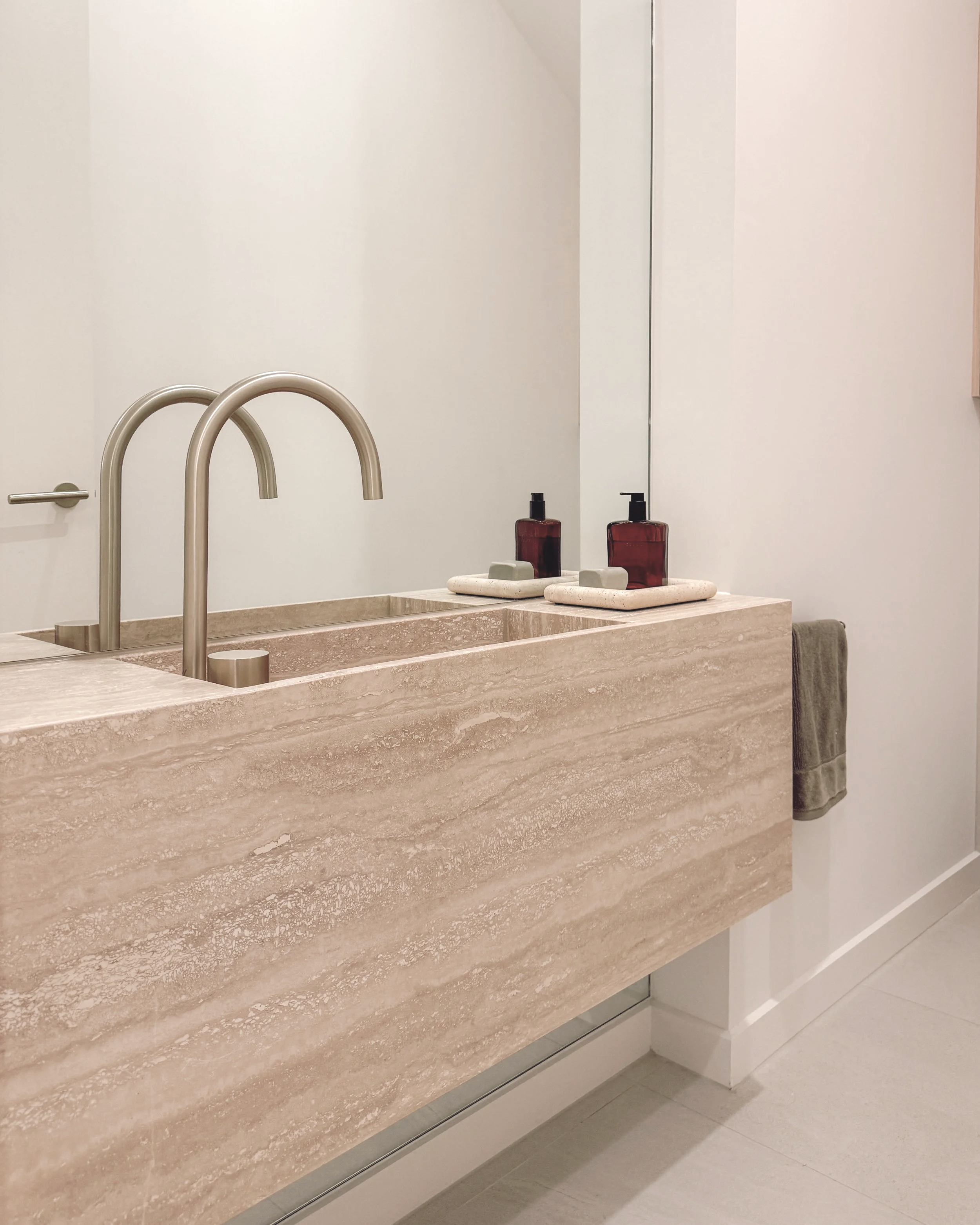 Contemporary Powder Room with custom travertine stone sink in Melbourne new-build. Designed by TID Studio, interior design in Sydney