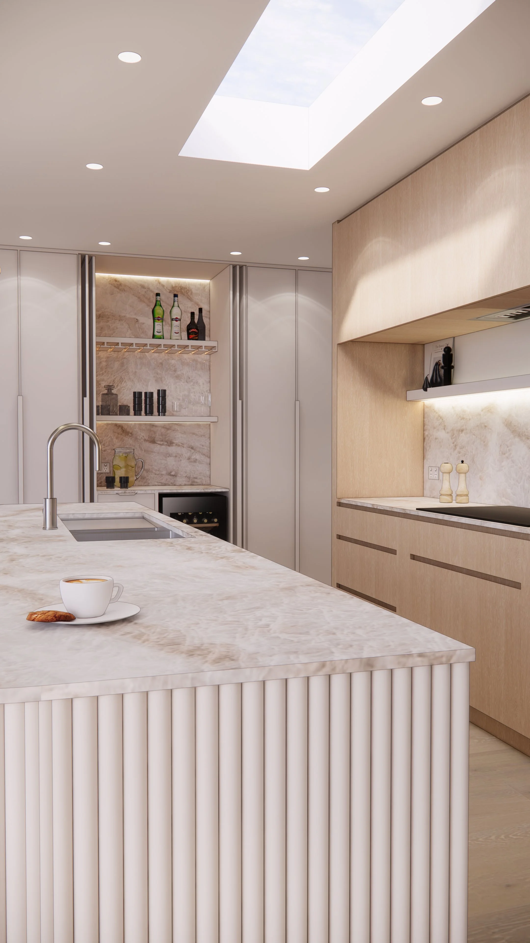 Soft neutral kitchen design featuring a fluted curved island and skylight, part of TID Studio’s Creamstone Escape project