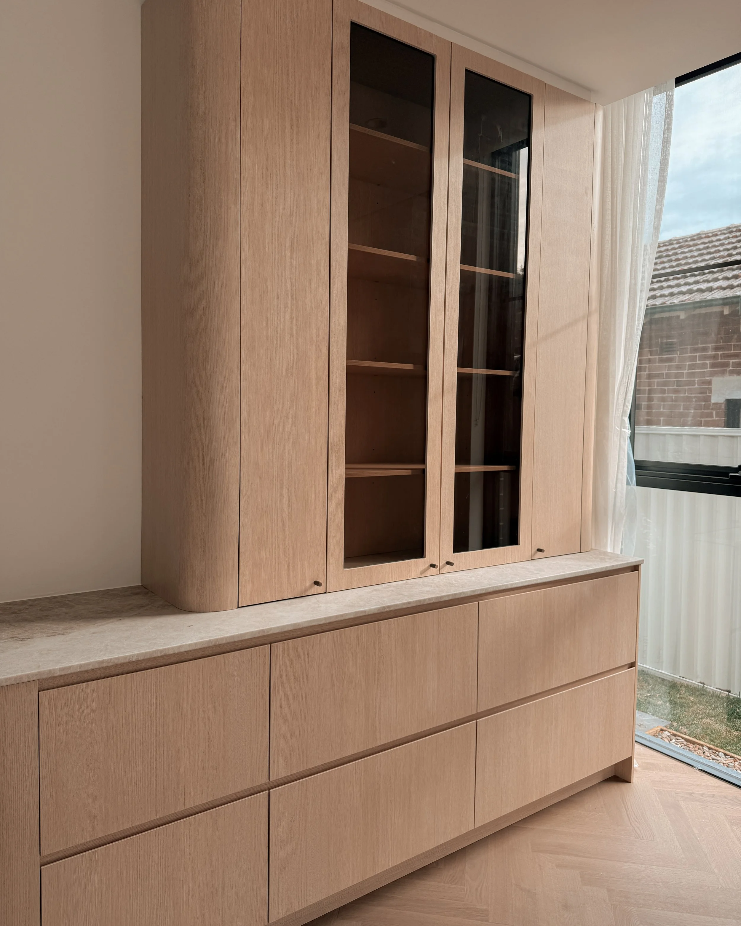 TID Studio. Contemporary kitchen design, taj mahal island, pantry, dining, bar, neutral creamy colour palette. Interior design Sydney. New build Five Dock