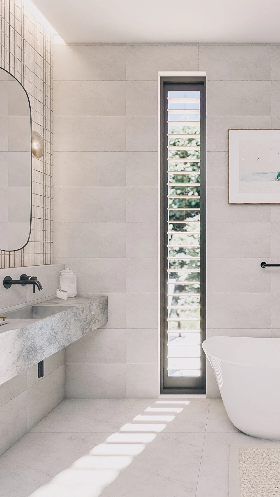 Freestanding bathtub between tall louvred windows in a calm modern bathroom