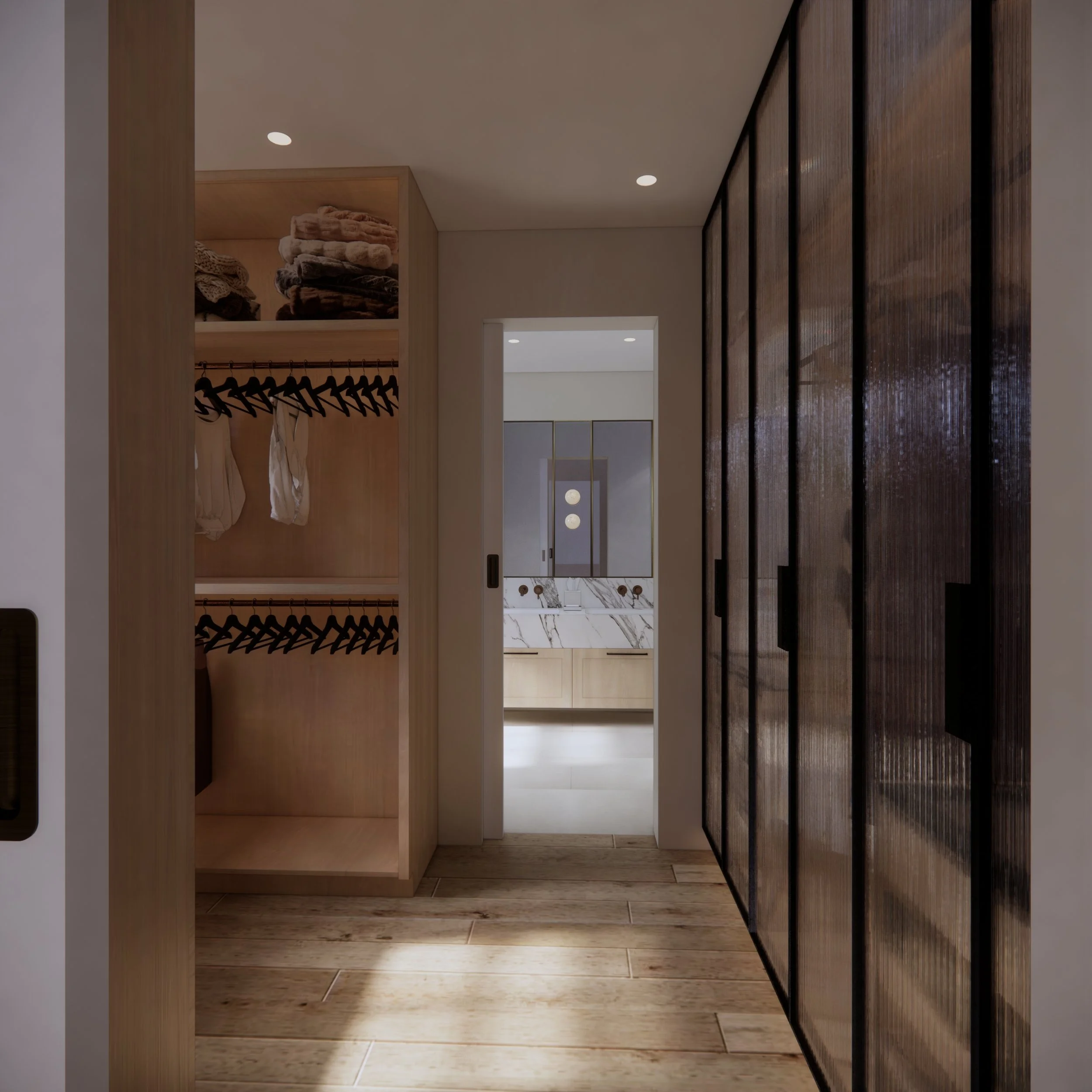 Custom walk-in robe with fluted glass wardrobes, integrated lighting and bespoke storage designed by TID Studio