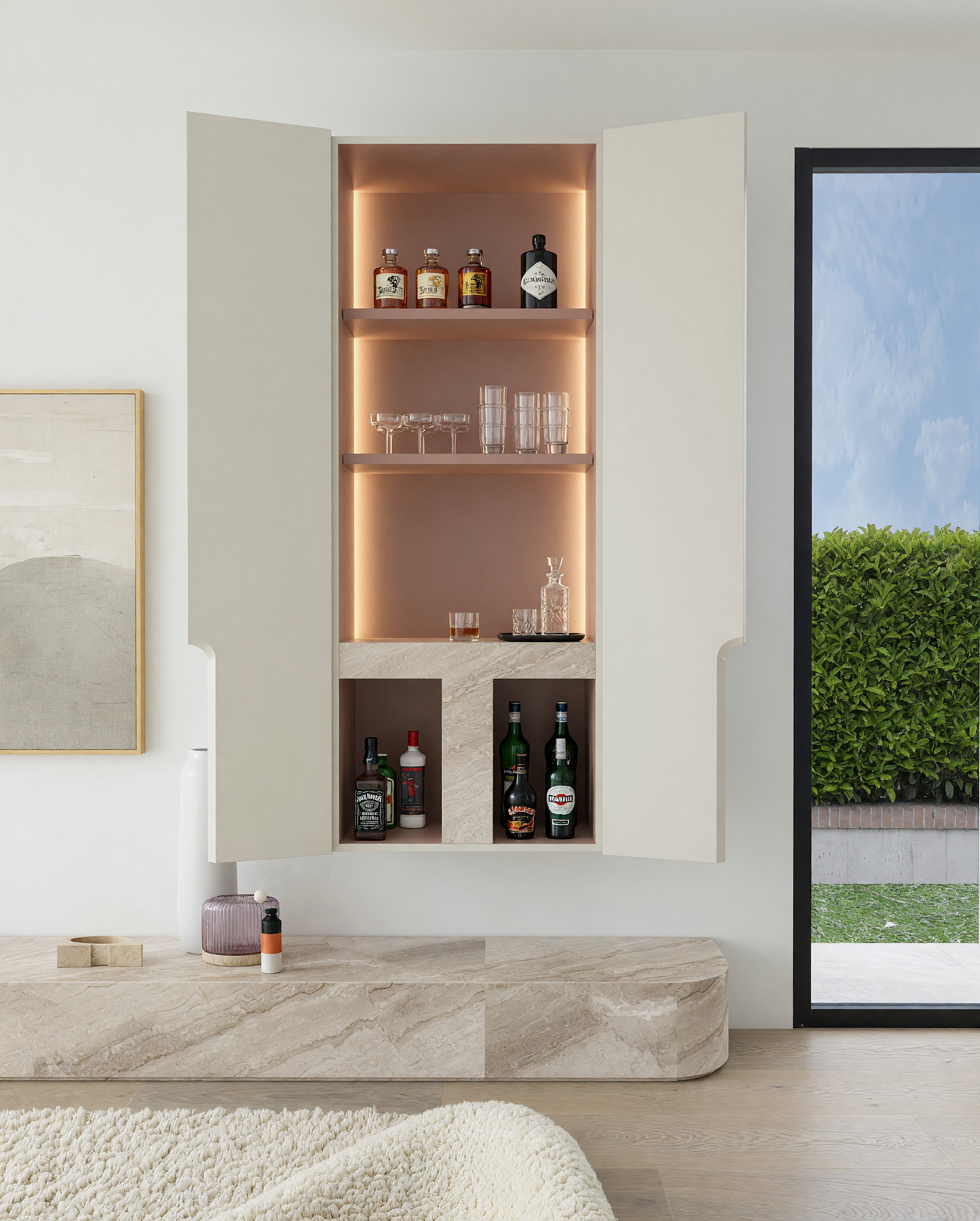 Modern open space kitchen, living room with stone ledge and bar cabinet, bronze fixtures and contemporary lighting, designed by TID Studio