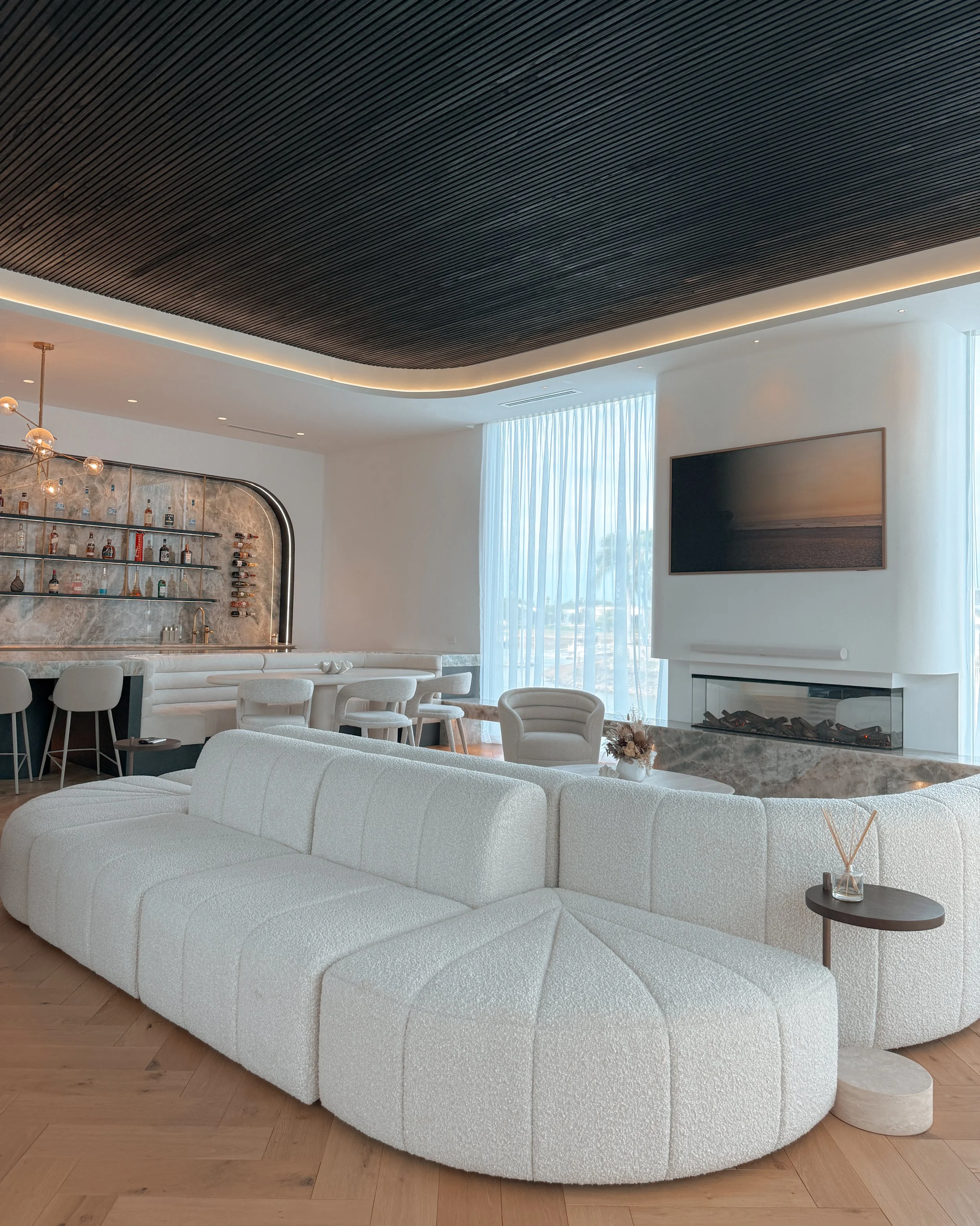 Modern coastal bar with island booth seating in a pool house in Brisbane, designed by TID Studio Sydney