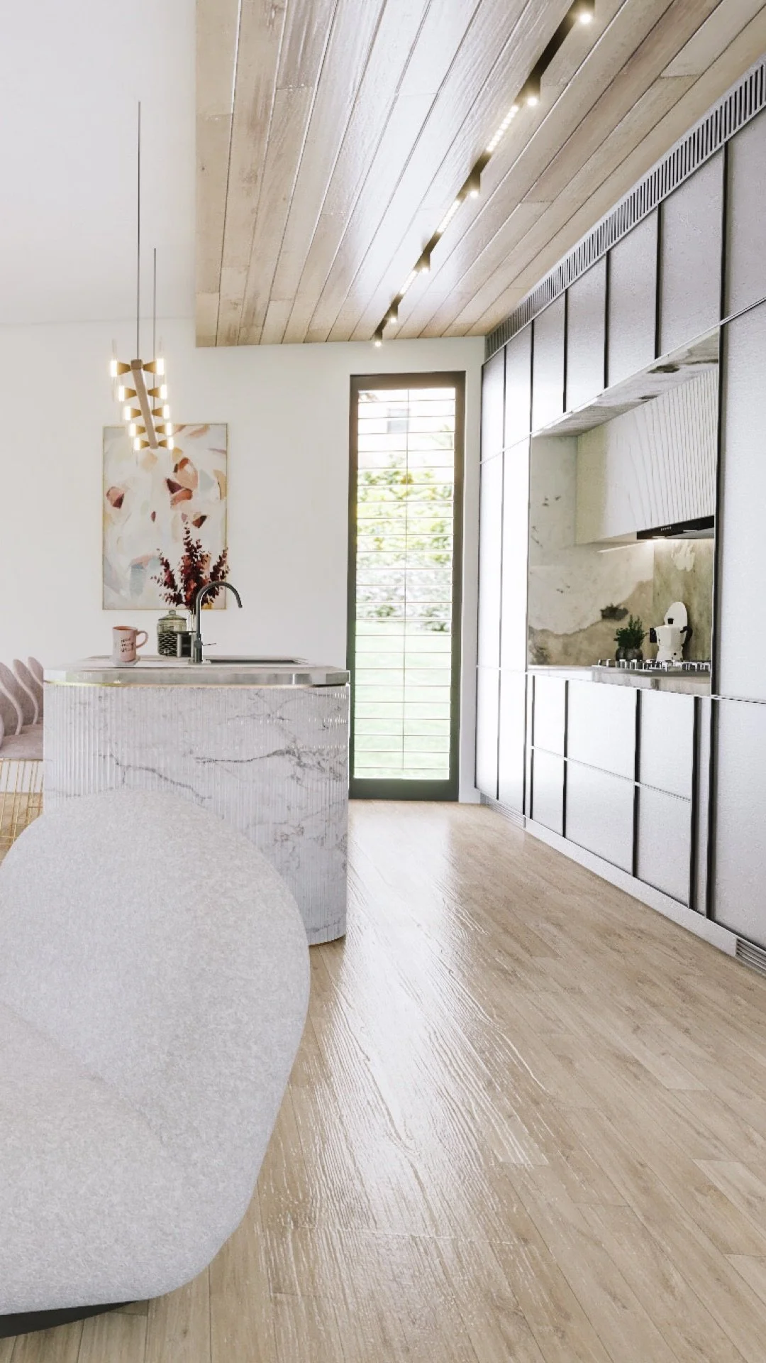 Fluted kitchen island with brass accents in a luxury coastal home by TID Studio