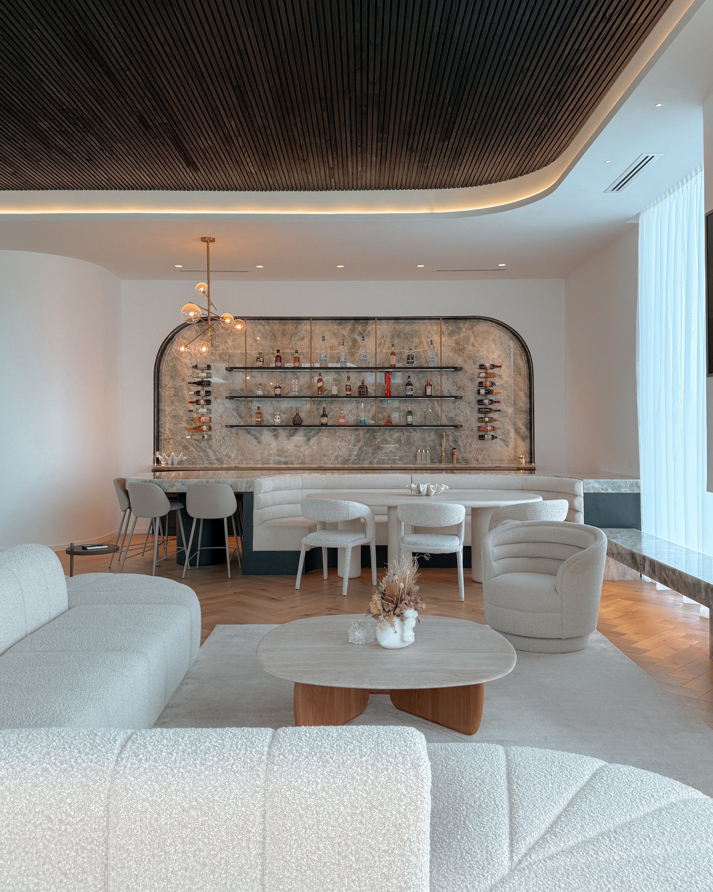 Modern coastal bar with island booth seating in a pool house in Brisbane, designed by TID Studio Sydney