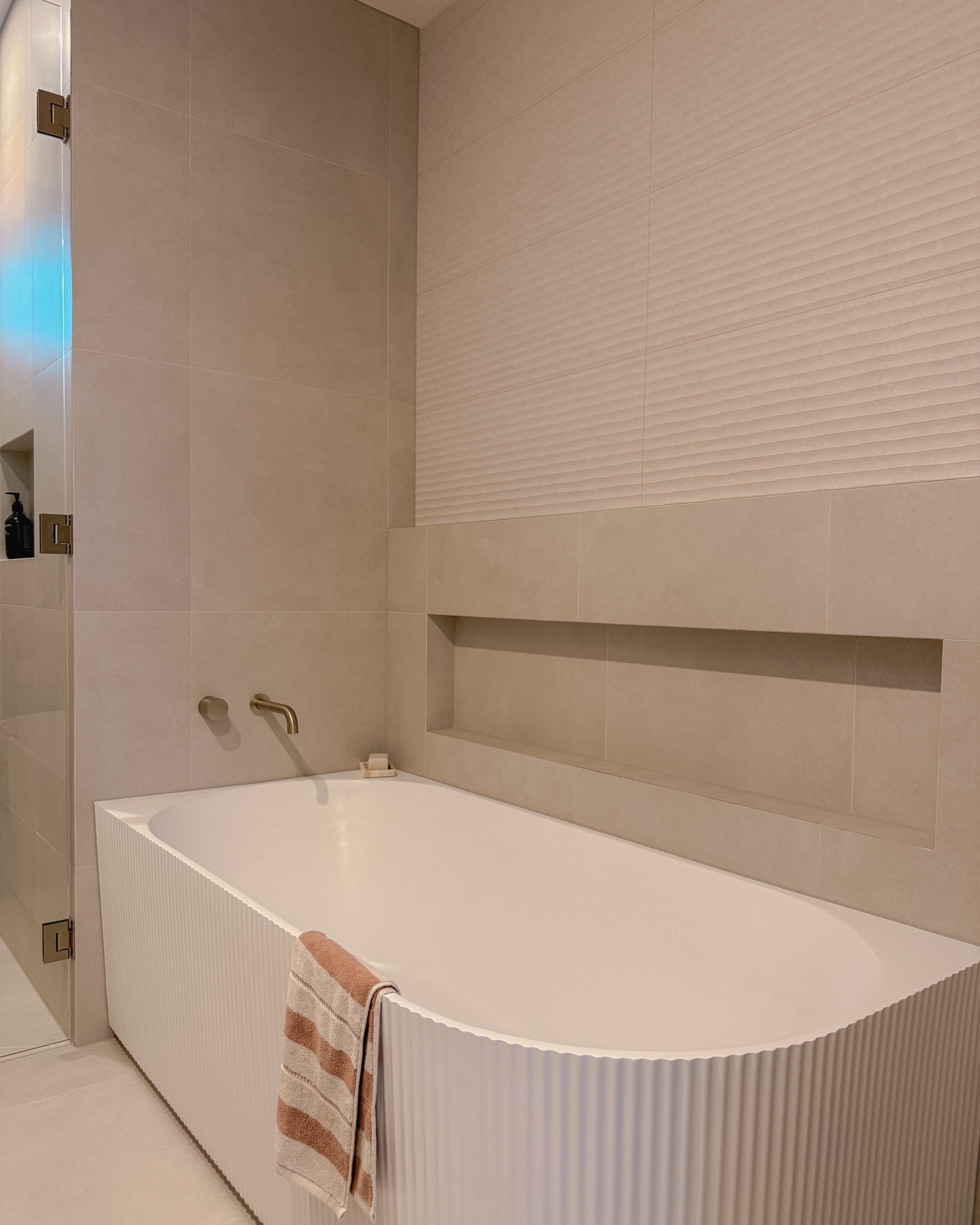 Contemporary bathroom with double vanity, enclosed shower and bathtub in Melbourne new-build. Designed by TID Studio, interior design in Sydney