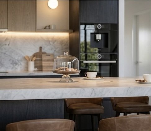 Modern black-and-oak kitchen design with stone island and timber ceiling feature — Brisbane interior design