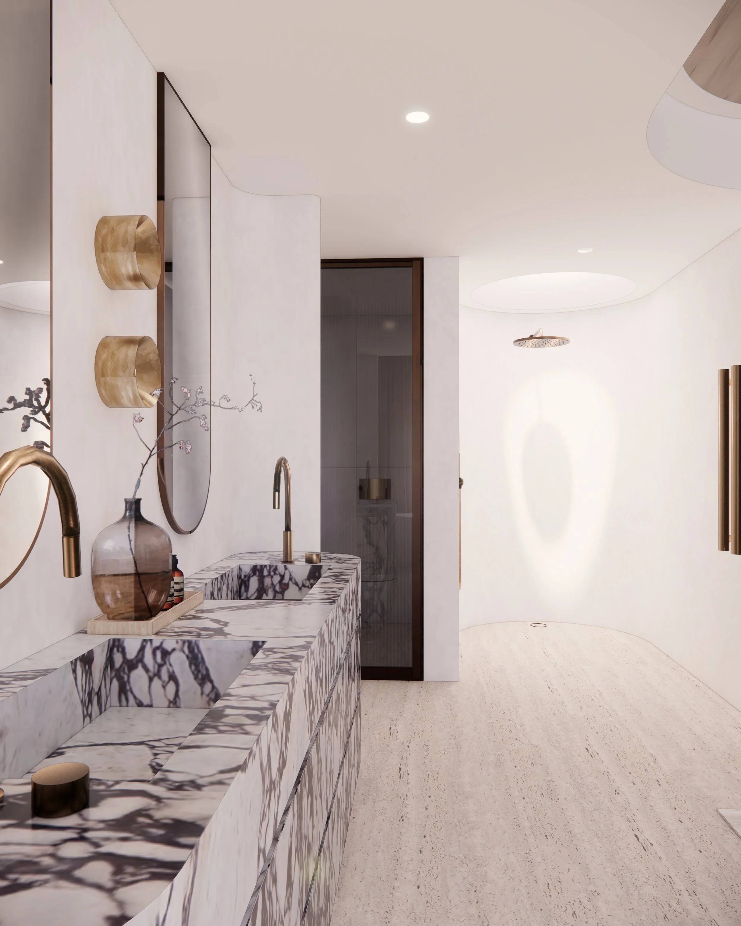 Sculptural double vanity in bold veined marble with curved detailing and brass tapware